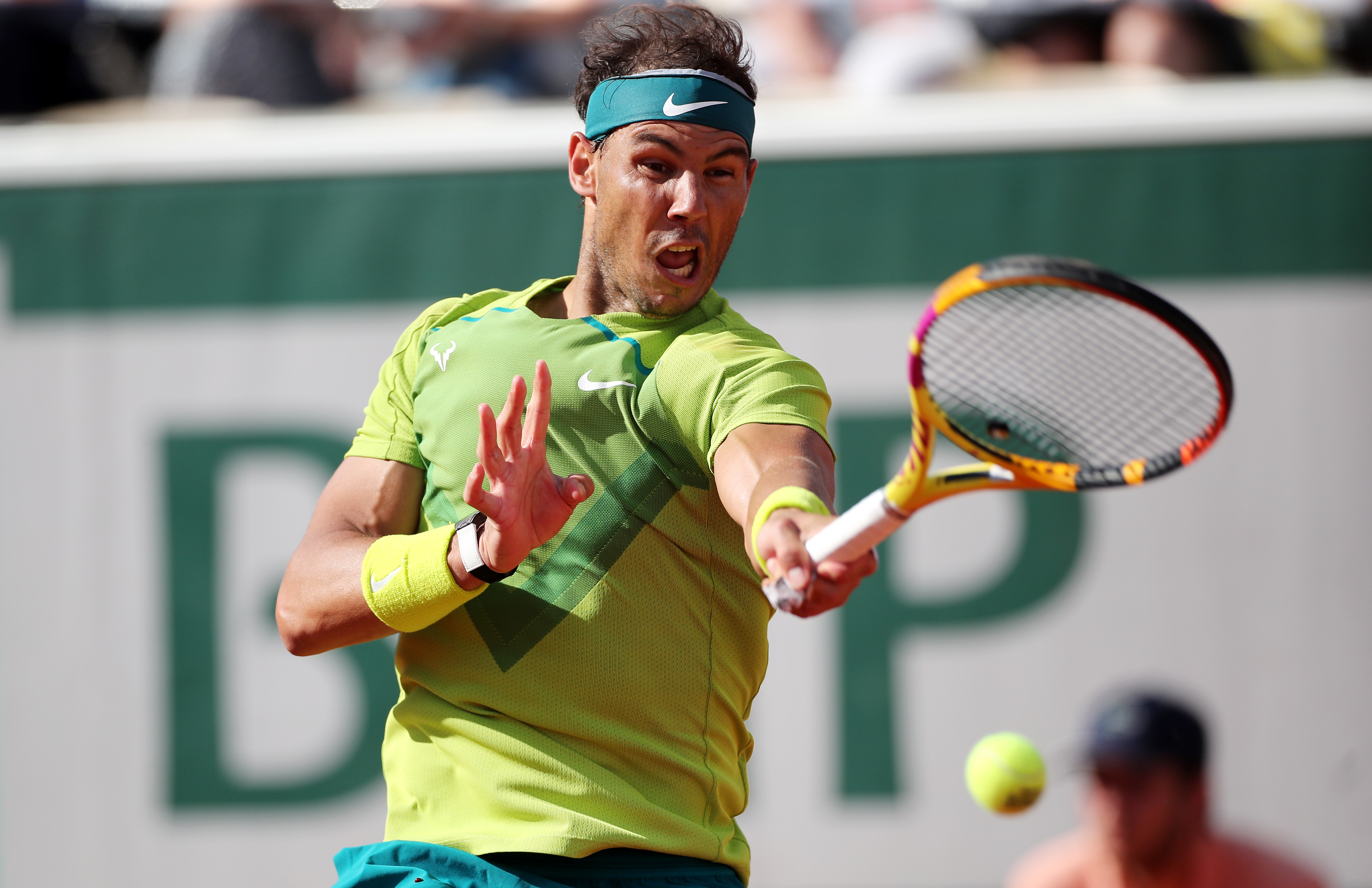 epa09980269 Rafael Nadal of Spain hits a forehand in the men's third round match against Botic van de Zandschulp of the Netherlands during the French Open tennis tournament at Roland Garros in Paris, France, 27 May 2022.  EPA-EFE/MARTIN DIVISEK