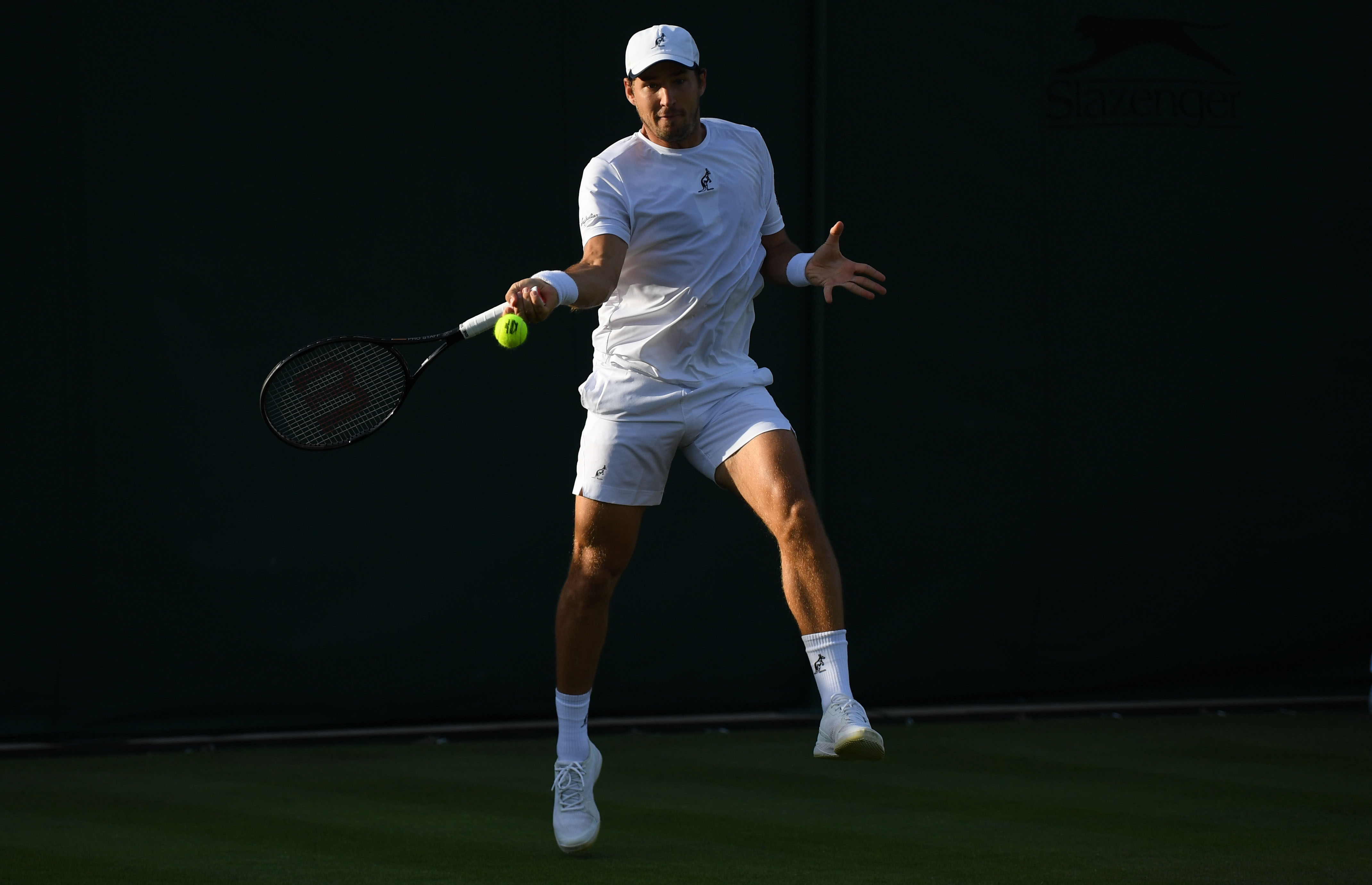 epa10037398 Dusan Lajovic of Serbia in action in the men's first round match against Pablo Carreno Busta of Spain at the Wimbledon Championships, in Wimbledon, Britain, 27 June 2022.  EPA-EFE/NEIL HALL   EDITORIAL USE ONLY
