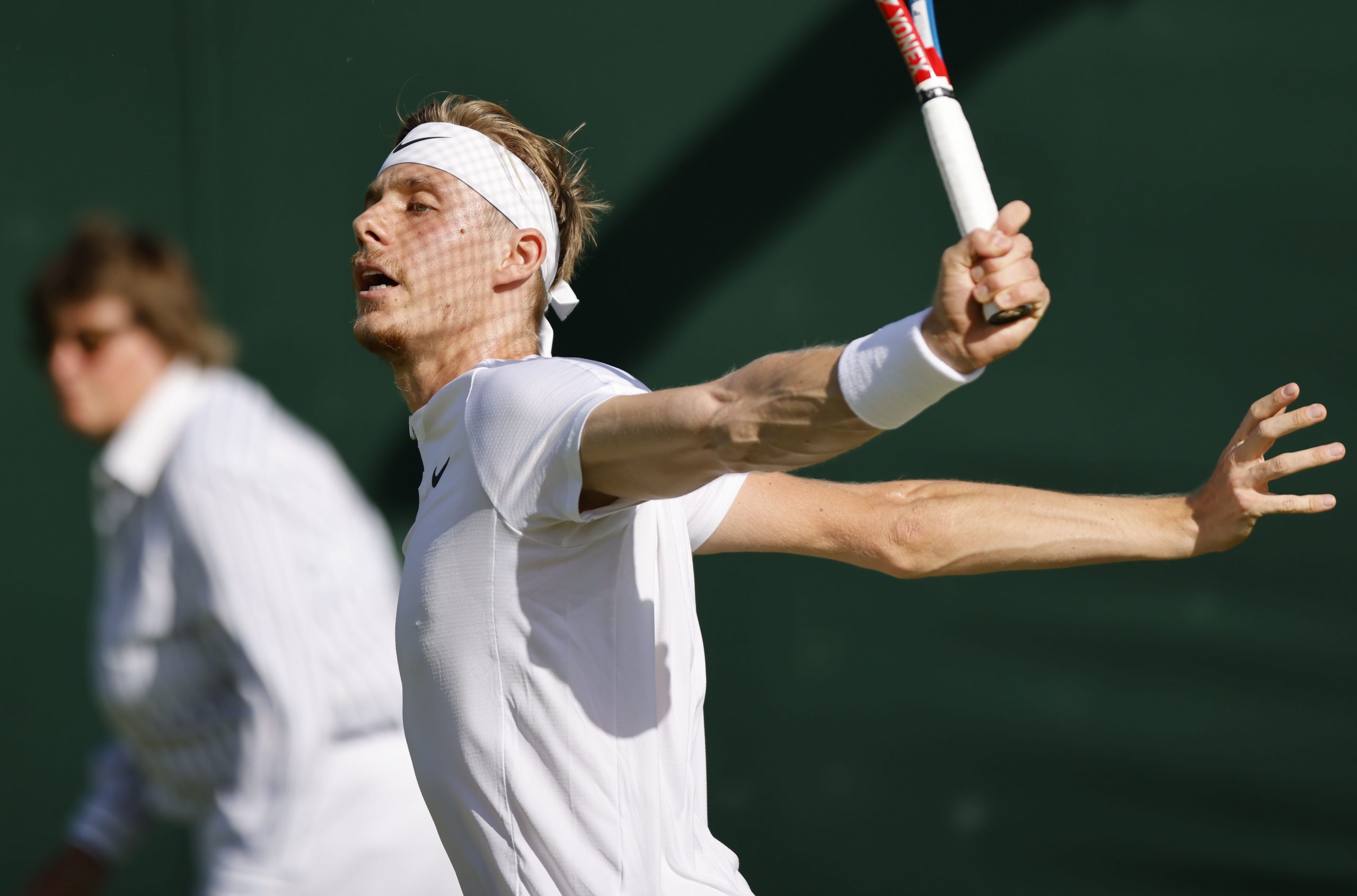 epa10039053 Denis Shapovalov of Canada in action in the men's first round match against Arthur Rinderknech of France at the Wimbledon Championships, in Wimbledon, Britain, 28 June 2022.  EPA-EFE/TOLGA AKMEN   EDITORIAL USE ONLY