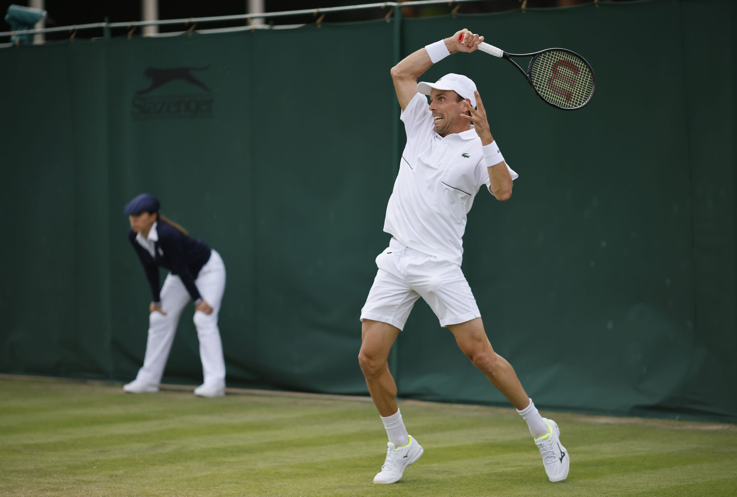 epa10039341 Roberto Bautista Agut of Spain in action in the men's first round match against Attila Balazs of Hungary at the Wimbledon Championships, in Wimbledon, Britain, 28 June 2022.  EPA-EFE/TOLGA AKMEN   EDITORIAL USE ONLY