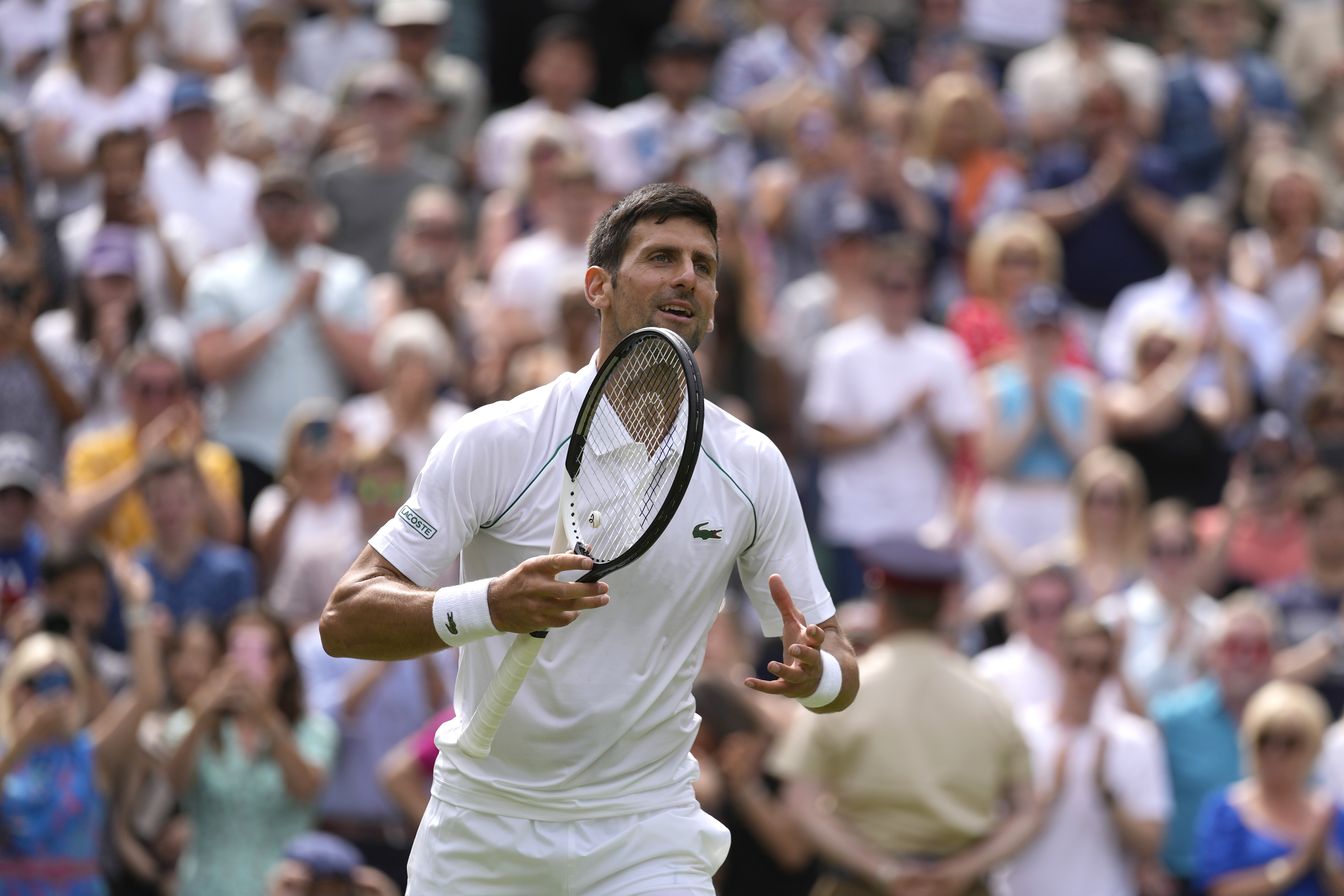 Serbia's Novak Djokovic celebrates defeating Australia's Thanasi Kokkinakis in a singles tennis match on day three of the Wimbledon tennis championships in London, Wednesday, June 29, 2022. (AP Photo/Alastair Grant)