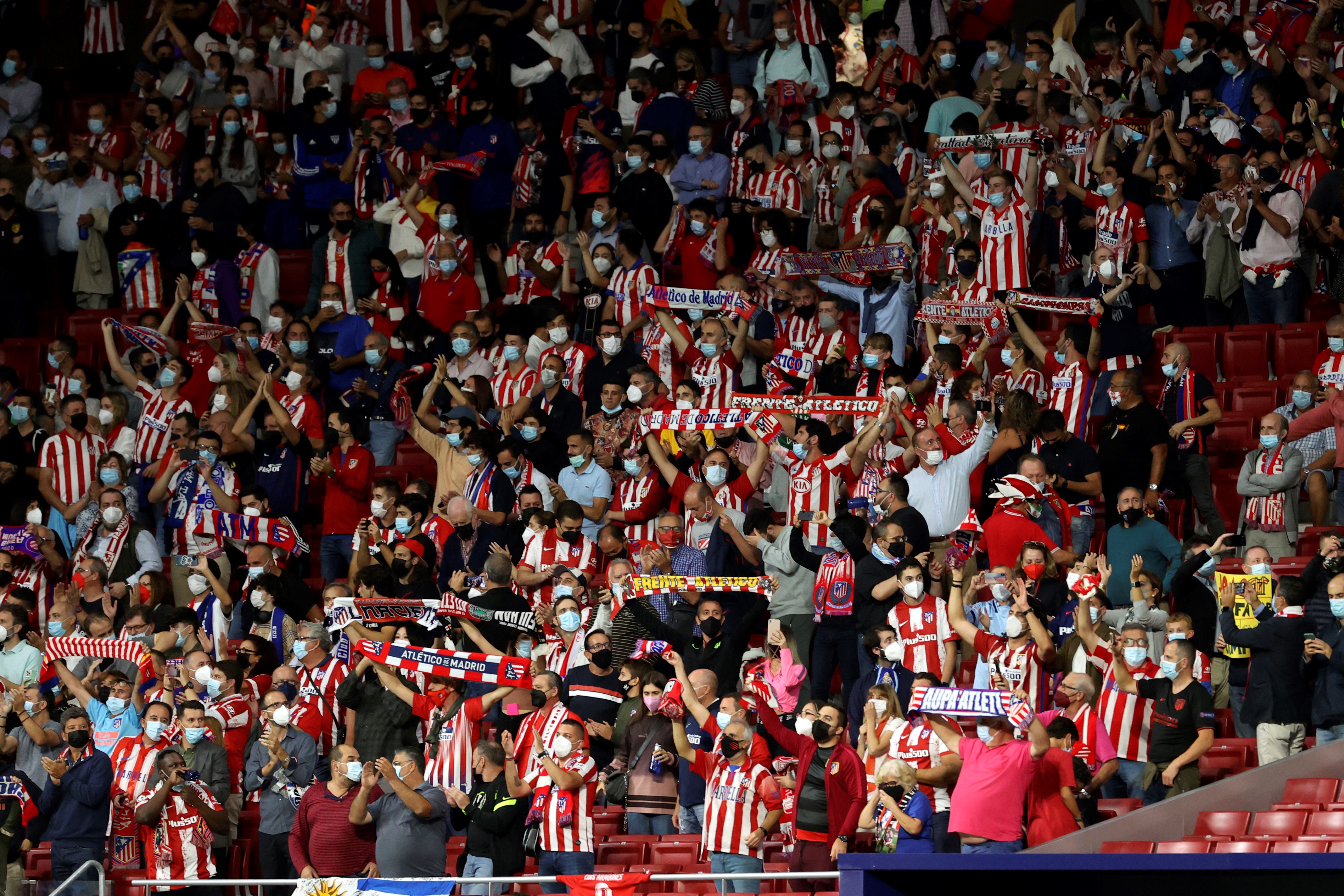 epa09470332 Atletico Madrid fans cheer ahead of the UEFA Champions League group B soccer match between Atletico Madrid and FC Porto at Wanda Metropolitano stadium in Madrid, Spain, 15 September 2021.  EPA-EFE/JuanJo Martin