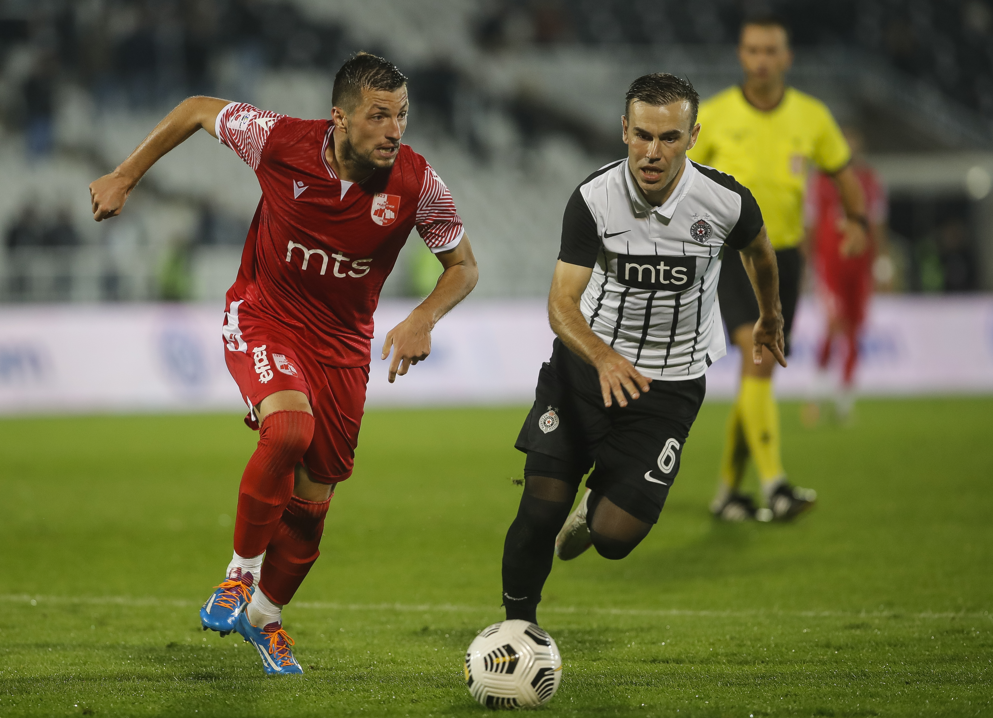 Aleksandar Pejovic (L) and Bibras Natkho Natcho
Fudbal-Super League Season 2021/2022
FK Partizan v Radnicki Nis
Beograd, 29.08.2021.
foto: Starsport.rs ©