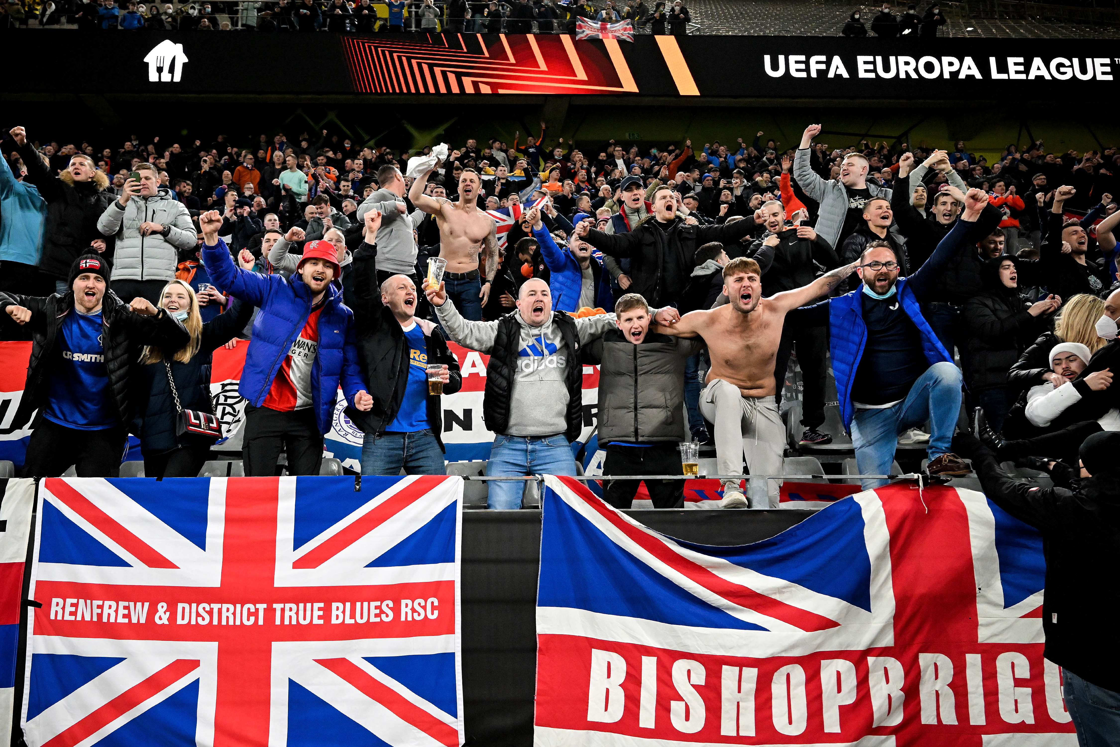 epa09767375 Rangers fans celebrate their team after winning the UEFA Europa League playoff soccer match between Borussia Dortmund and Glasgow Rangers FC at Signal Iduna Park in Dortmund, Germany, 17 February 2022.  EPA-EFE/SASCHA STEINBACH