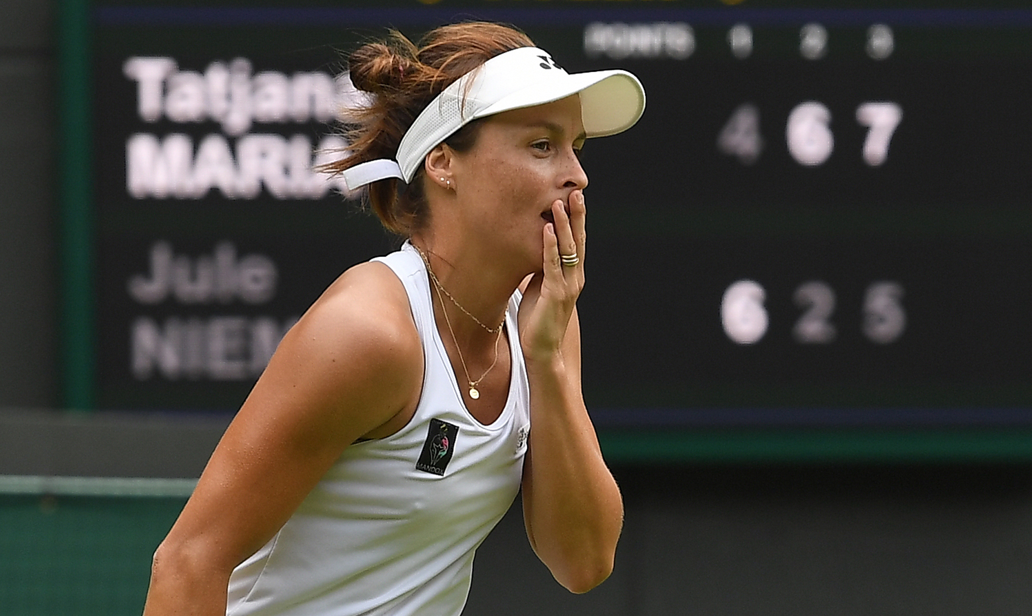 epa10053472 Tatjana Maria of Germany celebrates after winning her women's quarter final match against her compatriot Jule Niemeier at the Wimbledon Championships, in Wimbledon, Britain, 05 July 2022.  EPA-EFE/ANDY RAIN   EDITORIAL USE ONLY