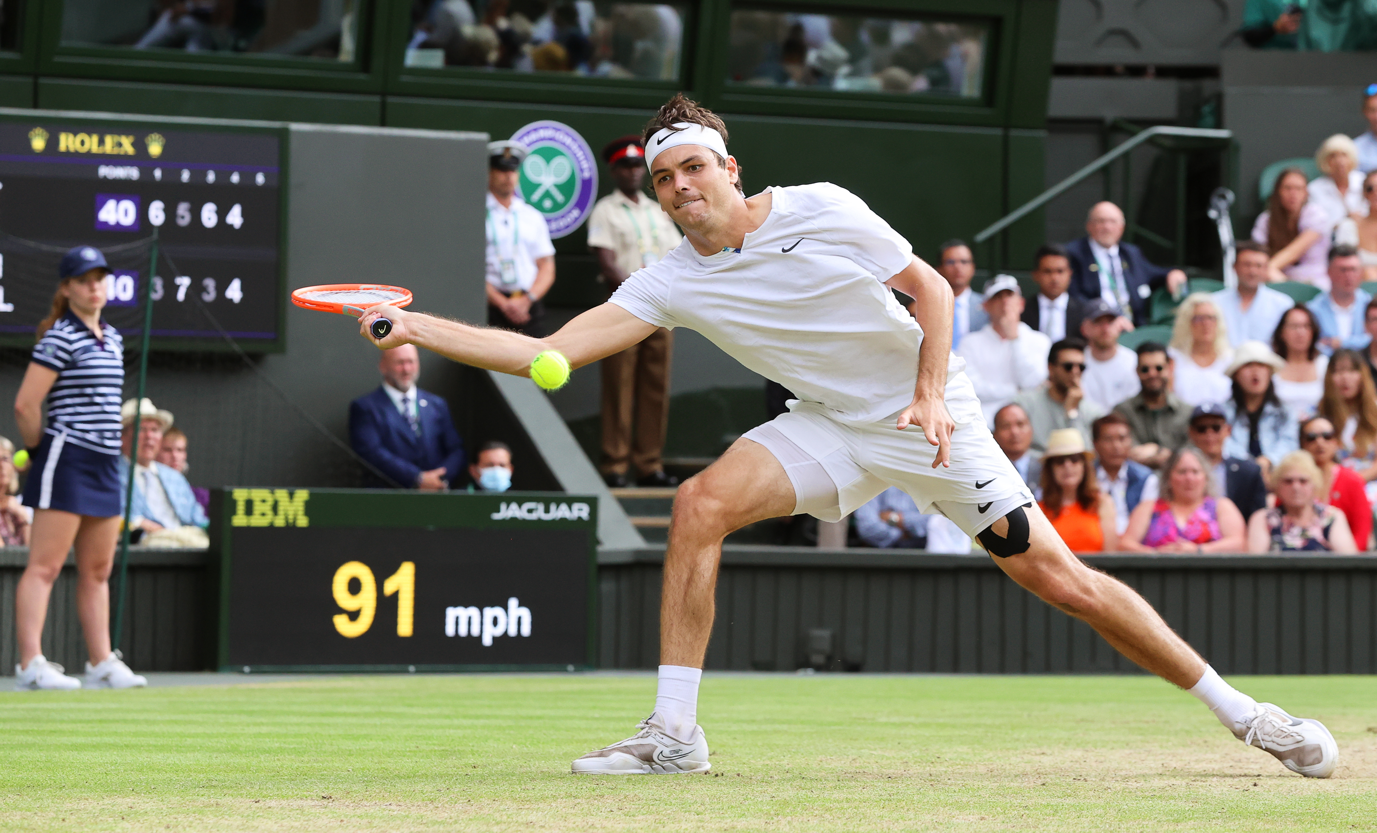 epa10055595 Taylor Fritz of the USA in action against Rafael Nadal of Spain during their men's quarter final match at the Wimbledon Championships in Wimbledon, Britain, 06 July 2022.  EPA-EFE/KIERAN GALVIN   EDITORIAL USE ONLY