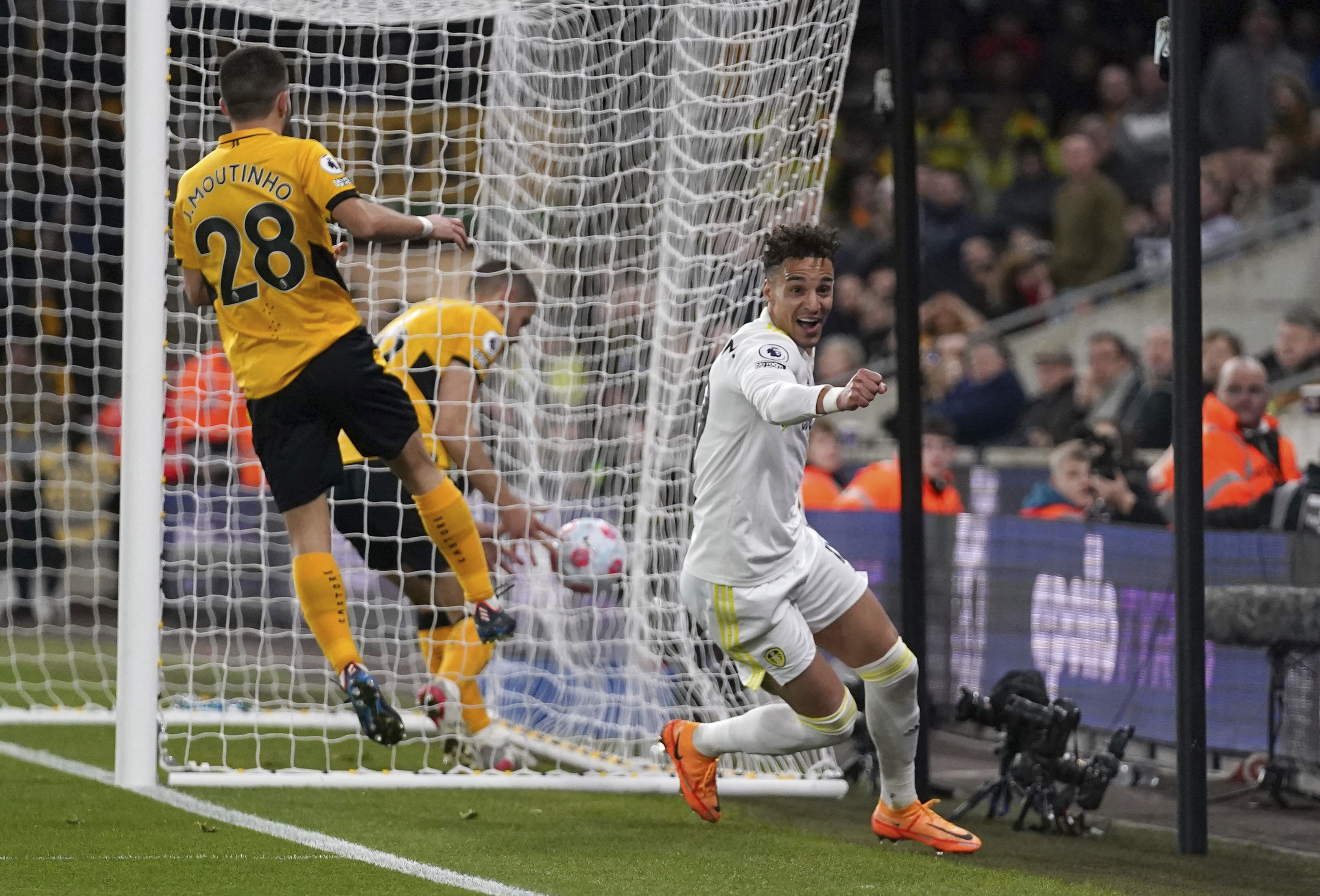 Leeds United's Rodrigo celebrates scoring during the English Premier League soccer match at Molineux Stadium, Wolverhampton, England, Friday March 18, 2022. (Nick Potts/PA via AP)