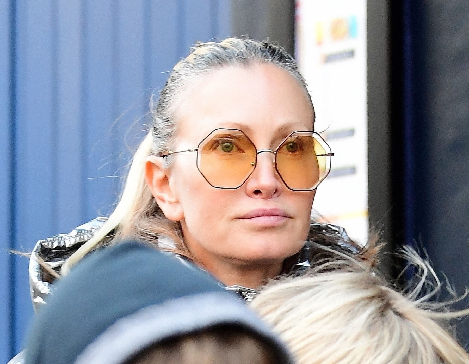 *EXCLUSIVE* The American Model Caprice Bourret stands out from the crowd in her striking metallic silver puffer hooded jacket out on a jaunt with husband Ty Comfort  around London's Notting Hill.