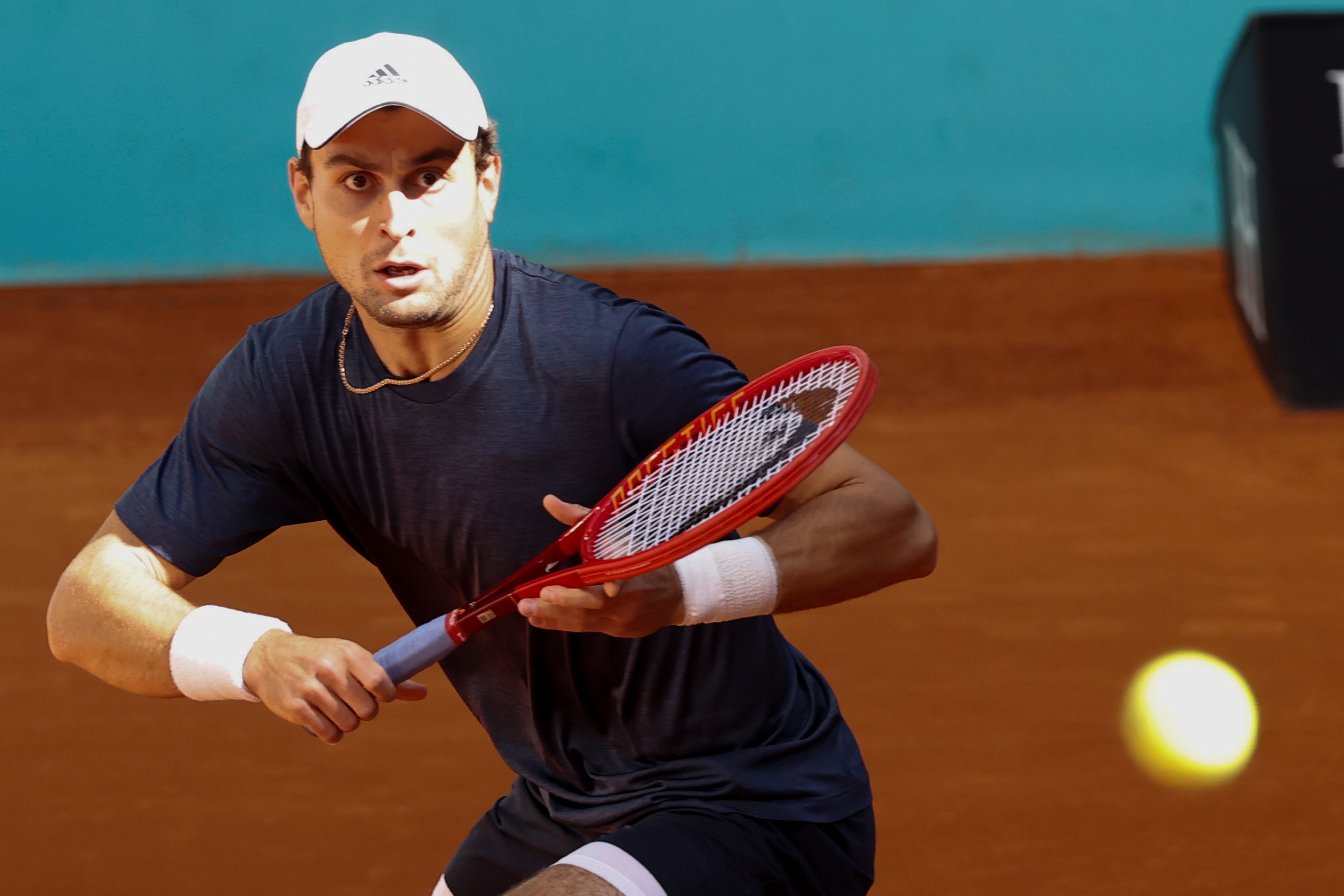 epa09180597 Aslan Karatsev of Russia in action against Aleksandr Bublik of Kazakhstan during their Mutua Madrid Open round of 16 match at the Mutua Madrid Open tennis tournament in Madrid, Spain, 05 May 2021.  EPA-EFE/CHEMA MOYA