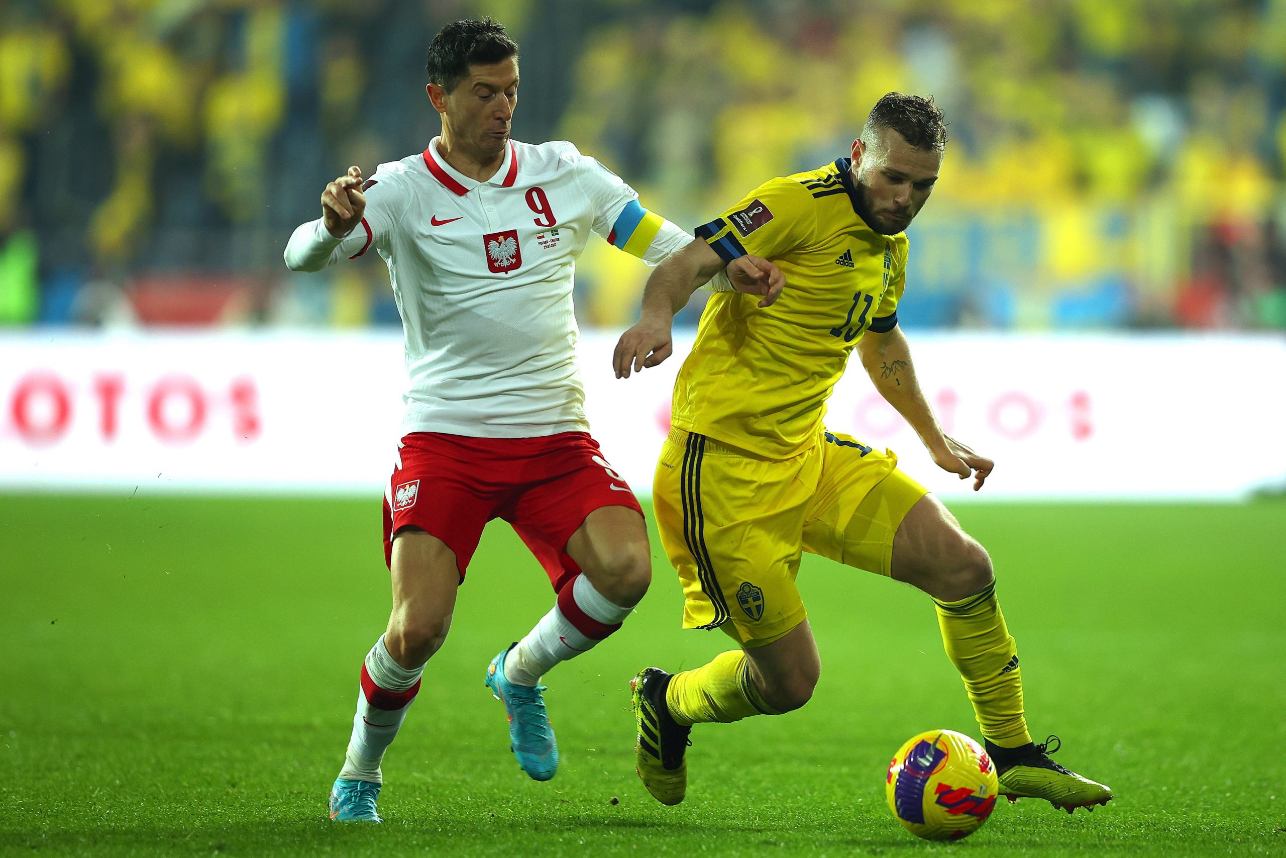 epa09859037 Poland's Robert Lewandowski (L) in action against Sweden's Jesper Karlstrom (R) during the FIFA World Cup 2022 playoff qualifying soccer match between Poland and Sweden in Chorzow, Poland, 29 March 2022.  EPA-EFE/LUKASZ GAGULSKI POLAND OUT