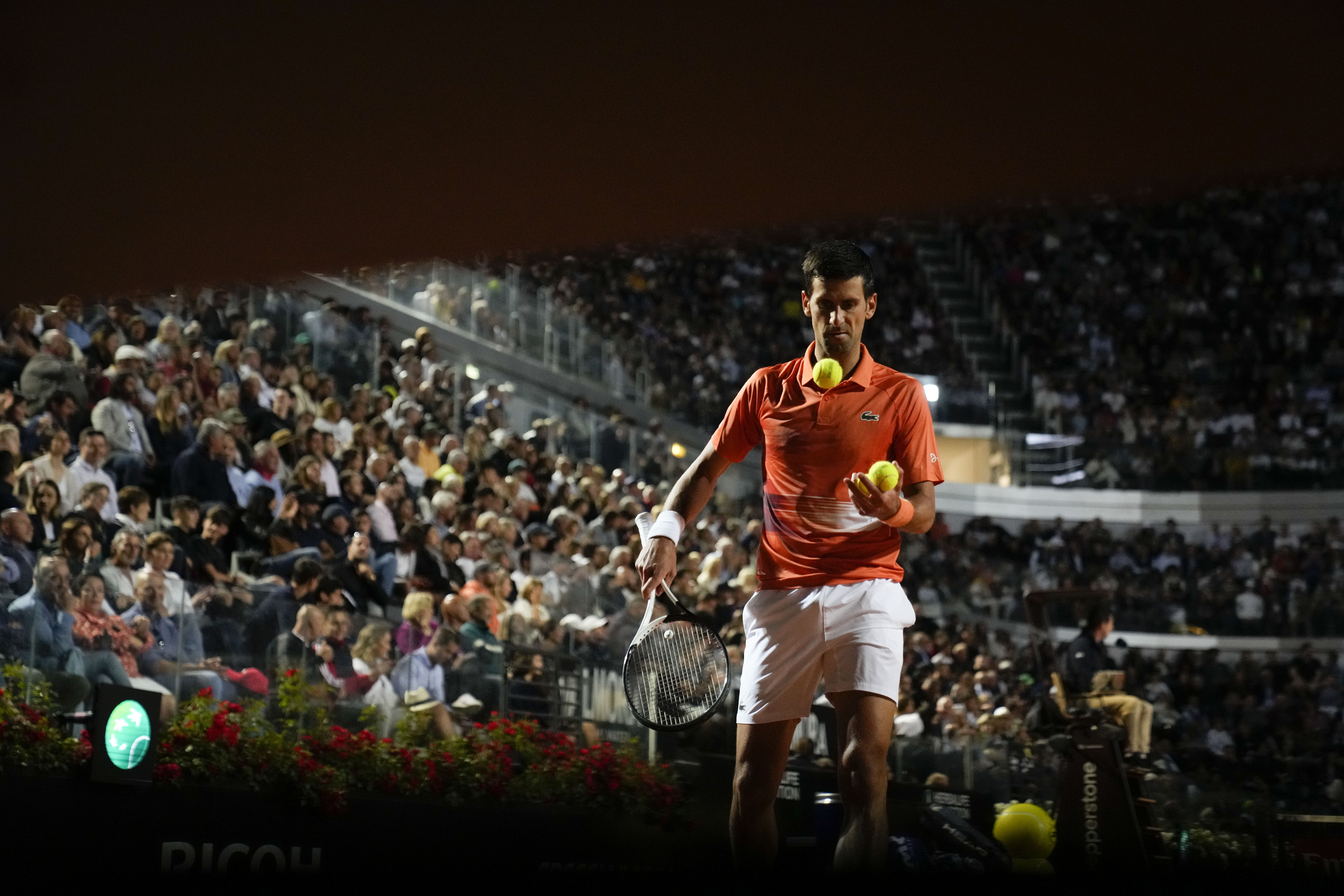Serbia's Novak Djokovic prepares to serve the ball during his semifinal match against Norway's Casper Ruud at the Italian Open tennis tournament, in Rome, Saturday, May 14, 2022. (AP Photo/Alessandra Tarantino)