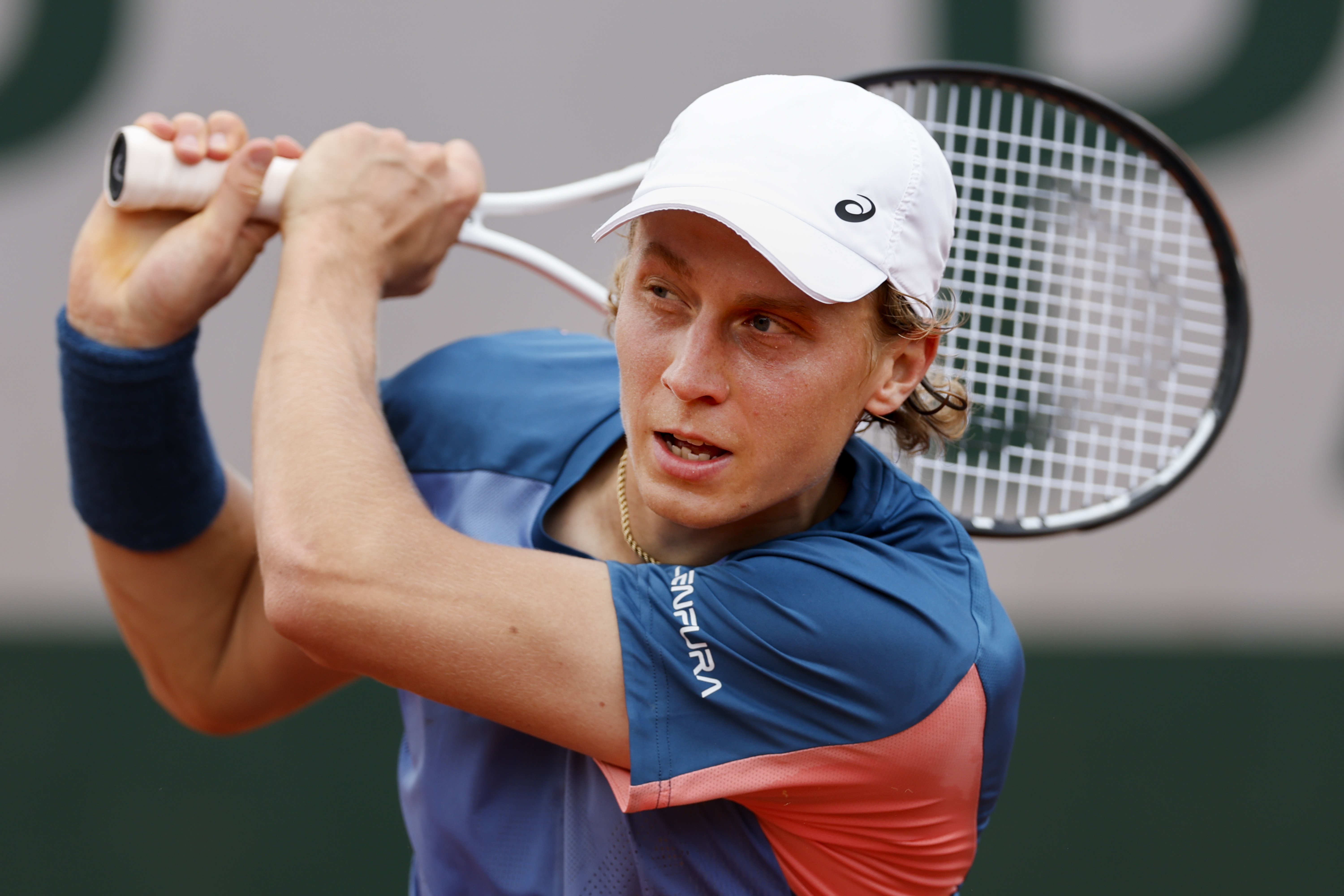 Finland's Emil Ruusuvuori plays a shot against Norway's Casper Ruud during their second round match at the French Open tennis tournament in Roland Garros stadium in Paris, France, Thursday, May 26, 2022. (AP Photo/Jean-Francois Badias)