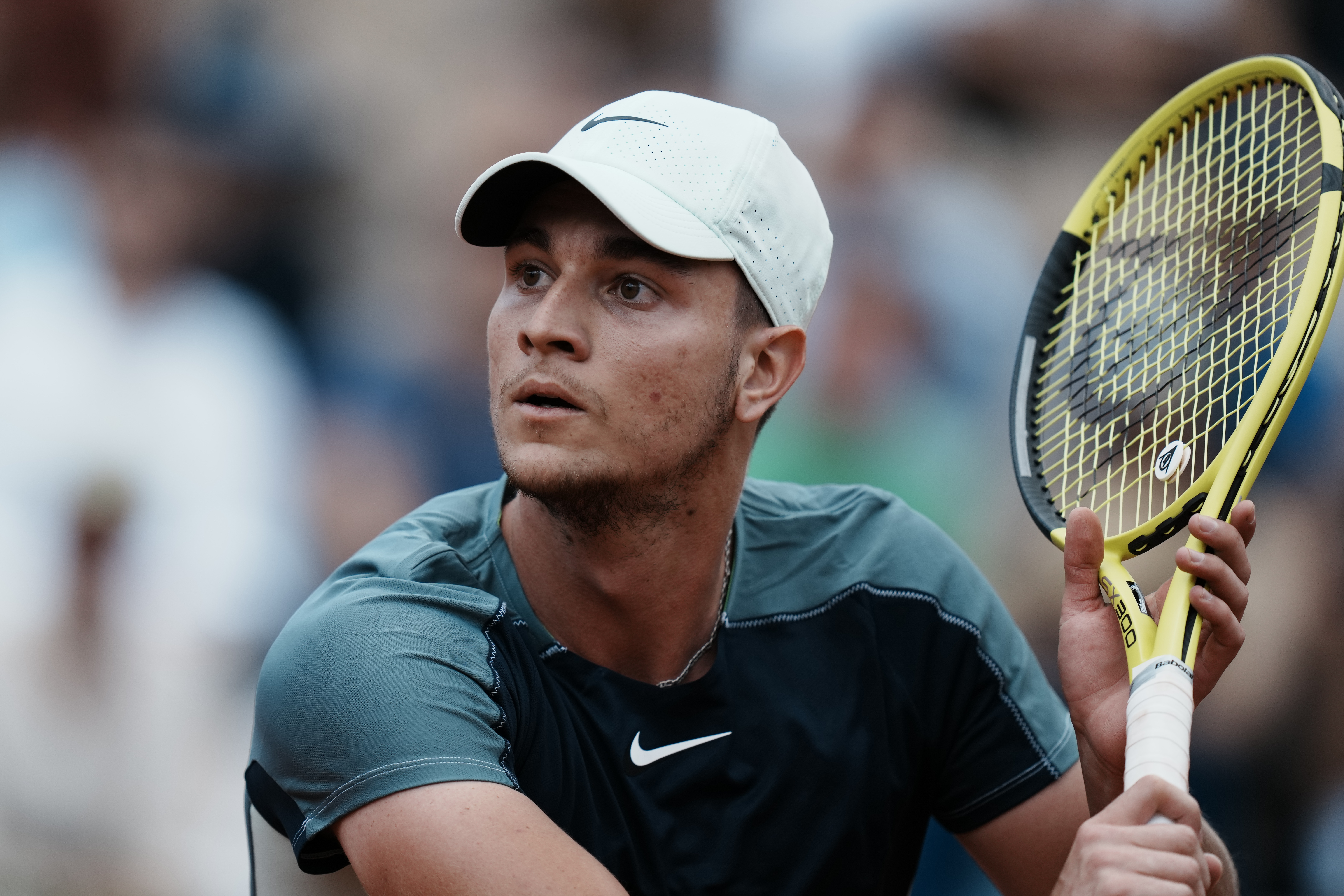 Serbia's Miomir Kecmanovic eyes the ball as he plays a shot against Russia's Daniil Medvedev during their third round match at the French Open tennis tournament in Roland Garros stadium in Paris, France, Saturday, May 28, 2022. (AP Photo/Thibault Camus)