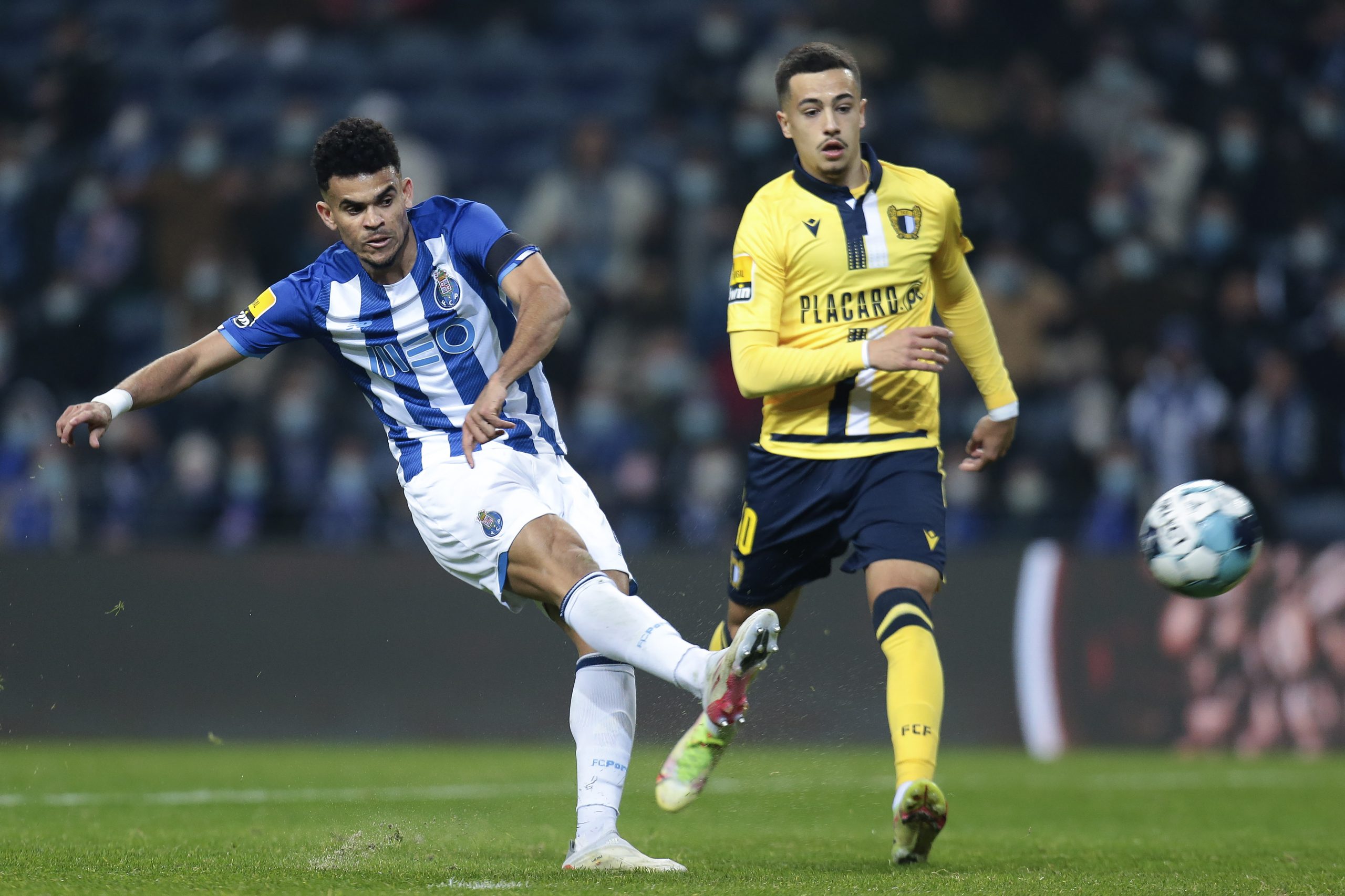 epa09705541 FC Porto's Luis Diaz (L) scores the 2-0 during the Portuguese First League soccer match, FC Porto vs FC Famalicao, held at Dragao stadium in Porto, Portugal, 23 January 2022.  EPA-EFE/MANUEL FERNANDO ARAUJO