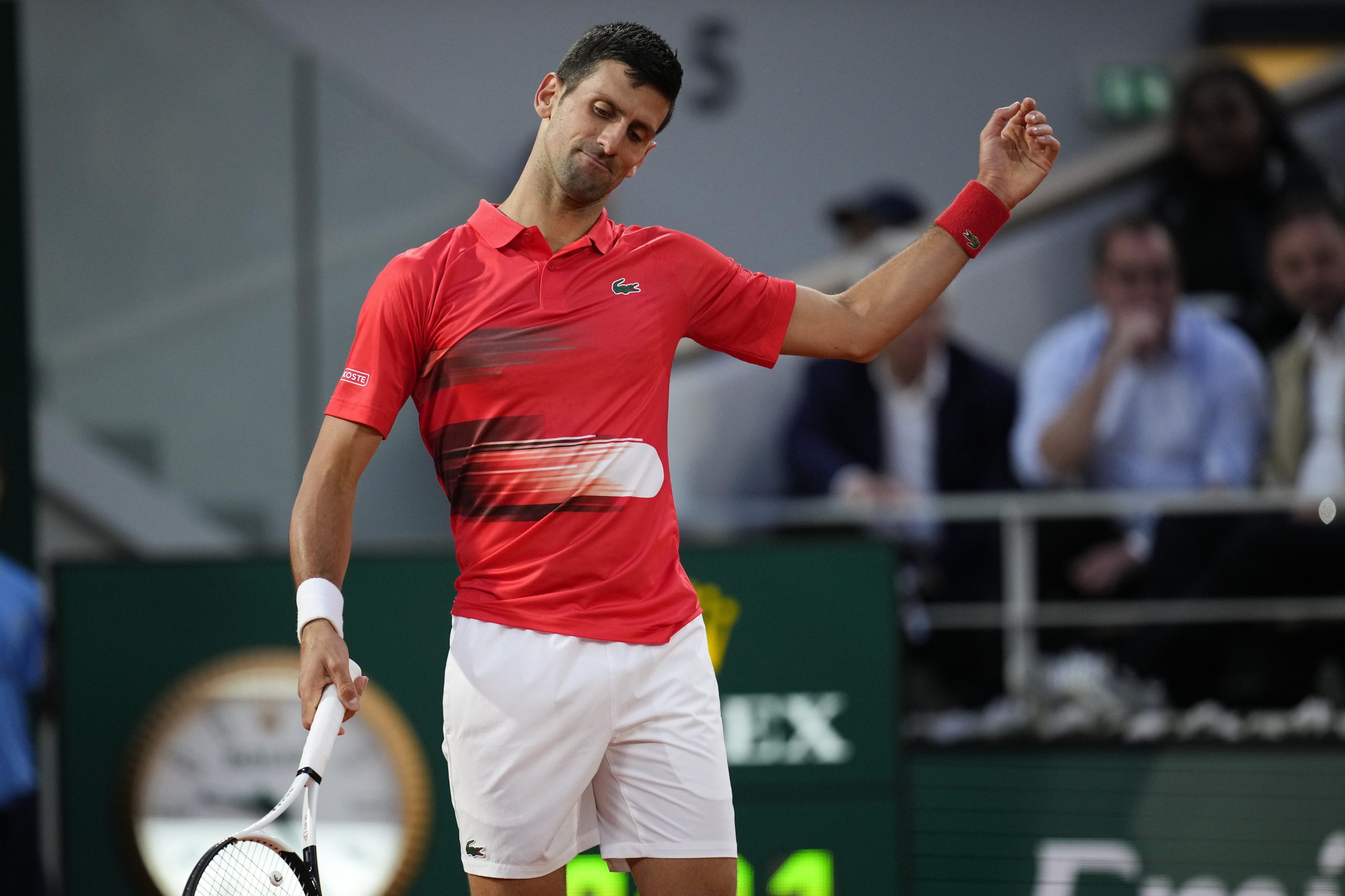 Serbia's Novak Djokovic reacts after missing a shot against Spain's Rafael Nadal during their quarterfinal match at the French Open tennis tournament in Roland Garros stadium in Paris, France, Tuesday, May 31, 2022. (AP Photo/Christophe Ena)