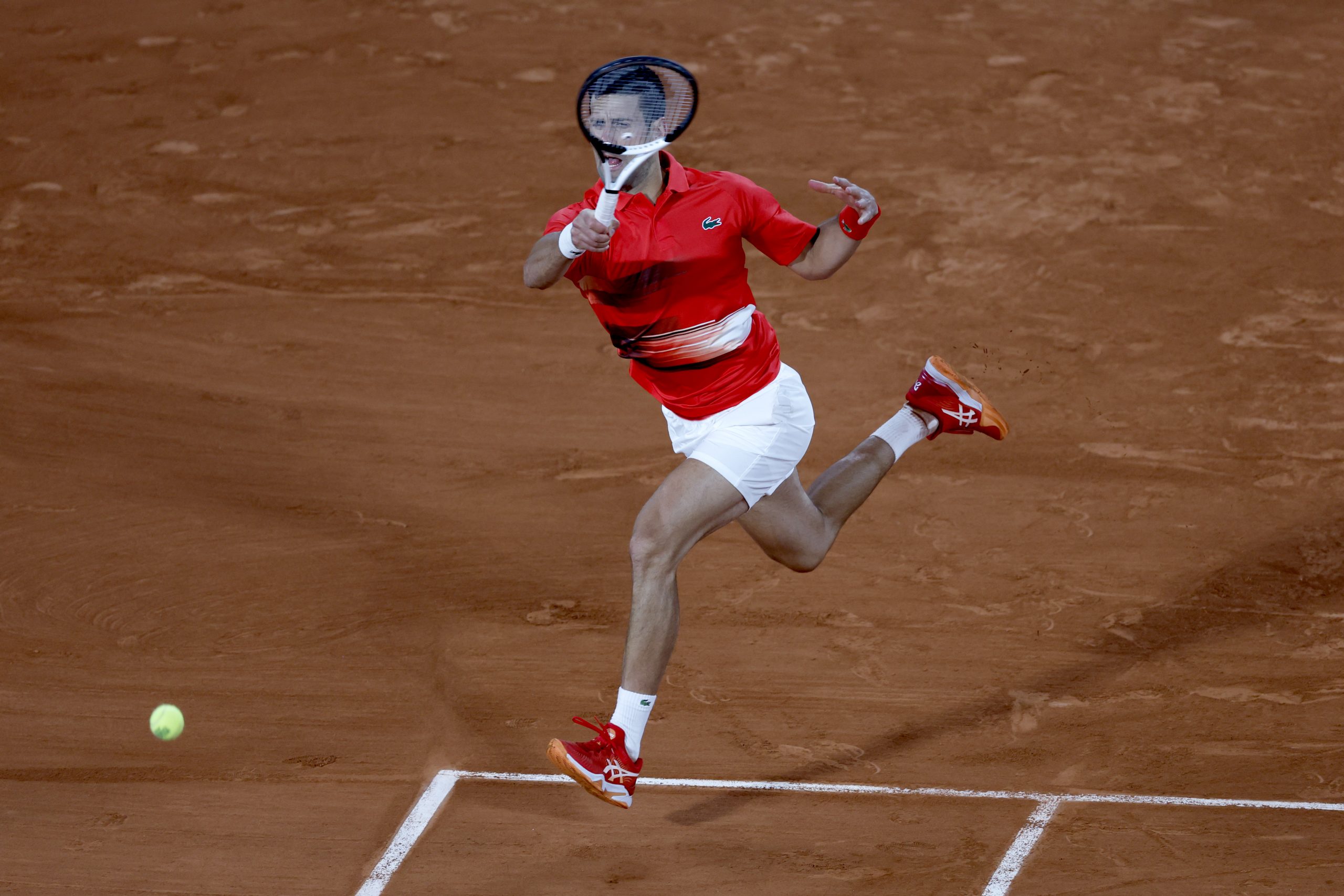 Serbia's Novak Djokovic returns the ball to Spain's Rafael Nadal during their quarterfinal match of the French Open tennis tournament at the Roland Garros stadium Tuesday, May 31, 2022 in Paris. (AP Photo/Jean-Francois Badias)