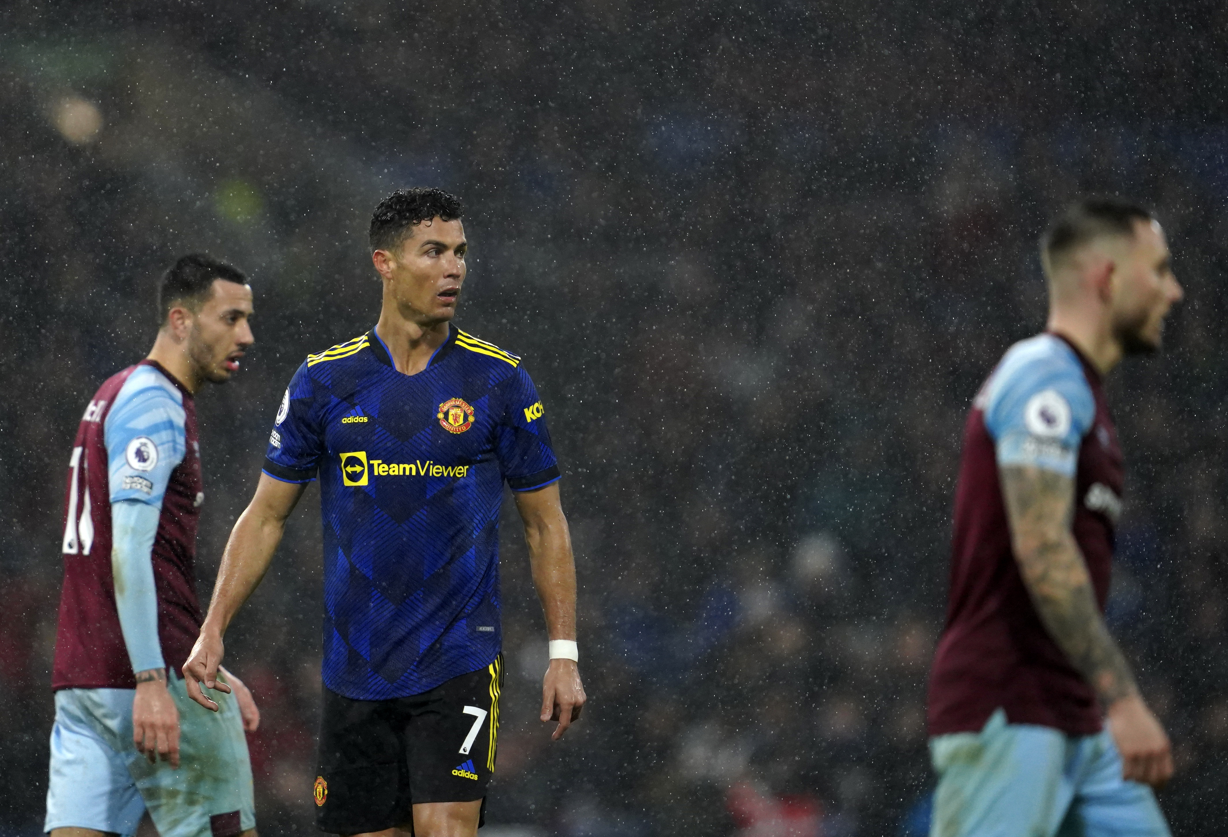 Manchester United's Cristiano Ronaldo, center, looks out during the English Premier League soccer match between Burnley and Manchester United at Turf Moor, in Burnley, England, Tuesday, Feb. 8, 2022. (AP Photo/Jon Super)