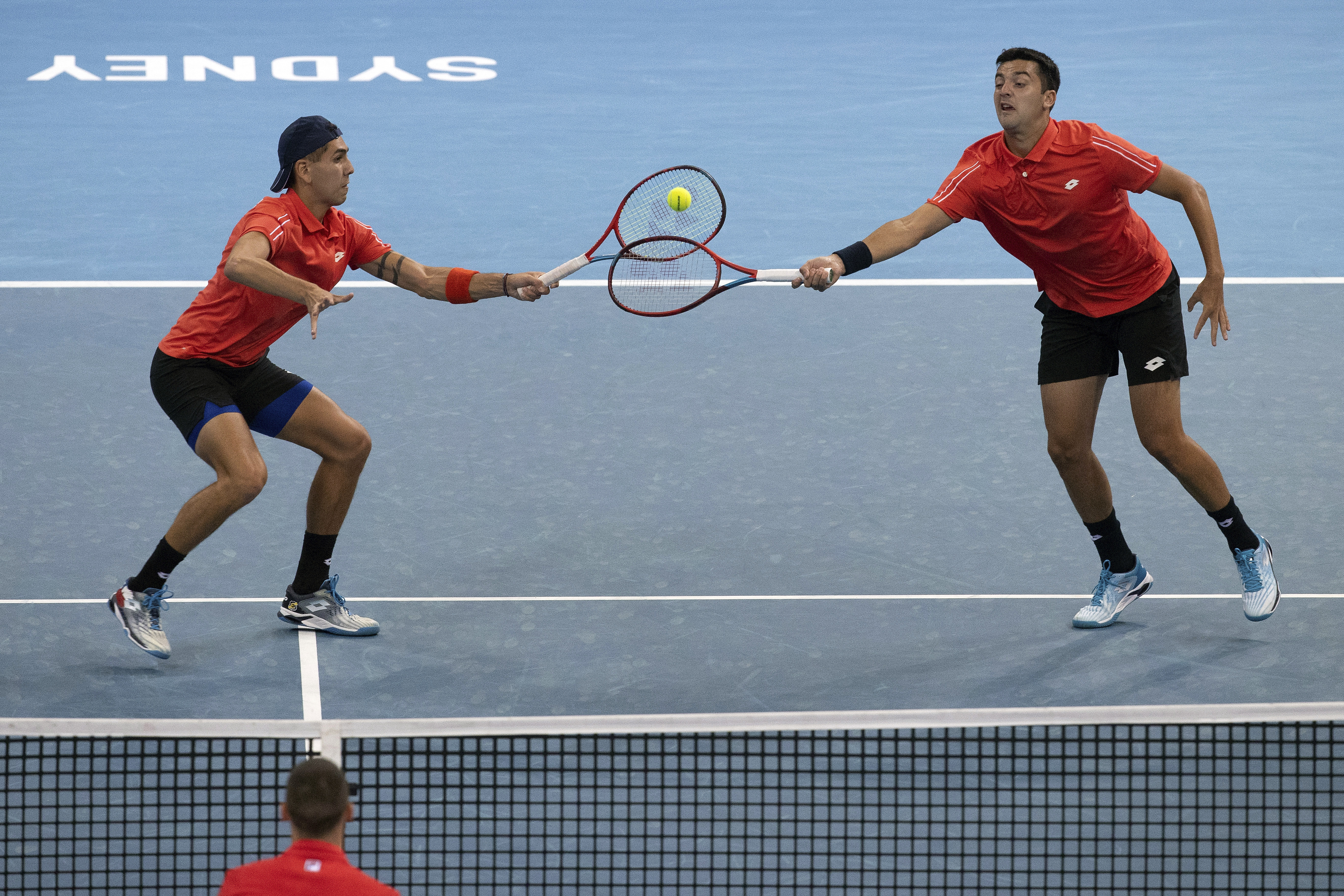 Tomas Barrios Vera, left, and Alejandro Tabilo of Chile play a shot against Serbia's Nikola Cacic and Matej Sabanov during their doubles match at the ATP Cup tennis tournament in Sydney, Monday, Jan. 3, 2022. (AP Photo/Steve Christo)