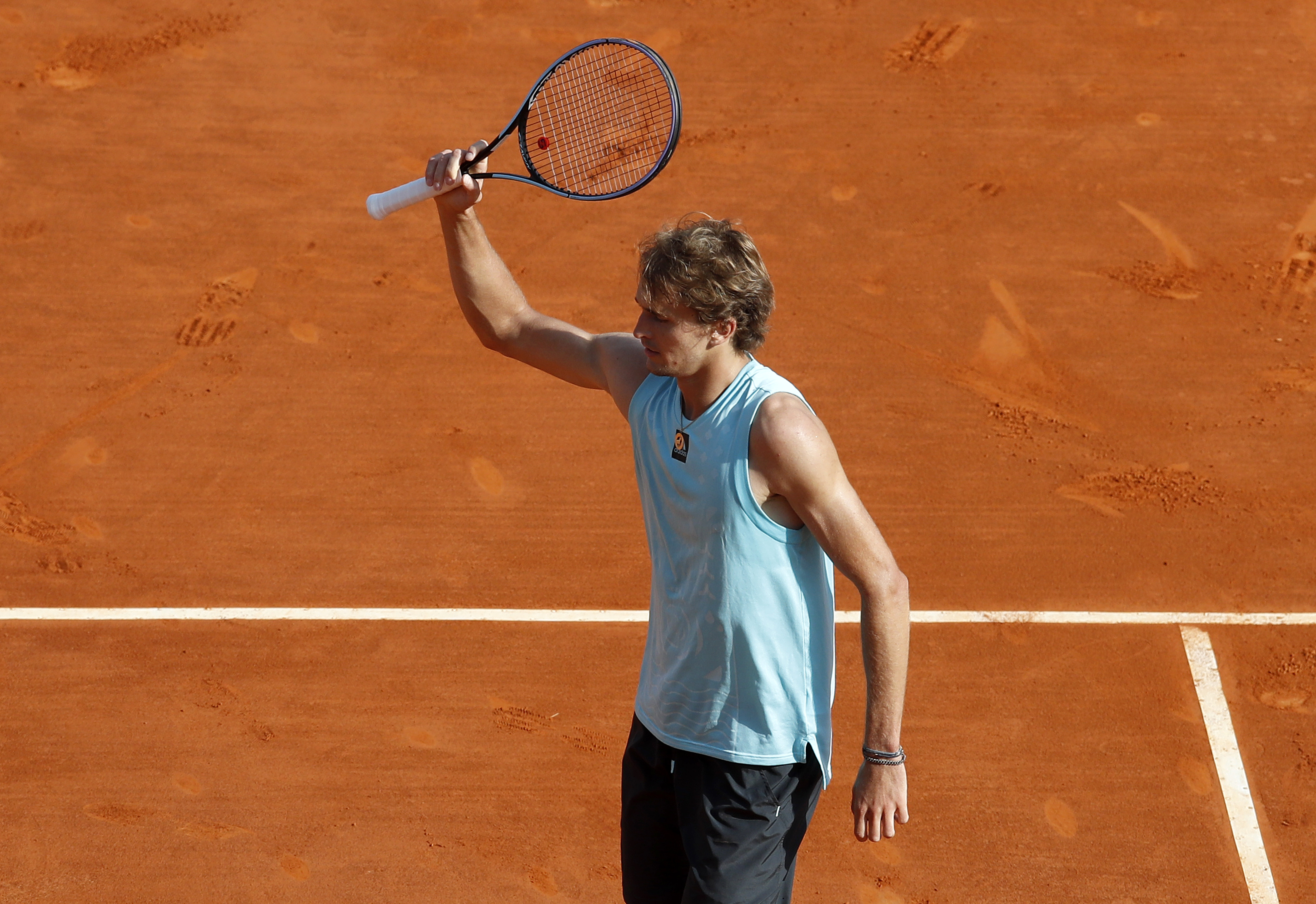epa09889932 Alexander Zverev of Germany celebrates winning against Pablo Carreno Busta of Spain during their third round match at the Monte-Carlo Rolex Masters tournament in Roquebrune Cap Martin, France, 14 April 2022.  EPA-EFE/SEBASTIEN NOGIER