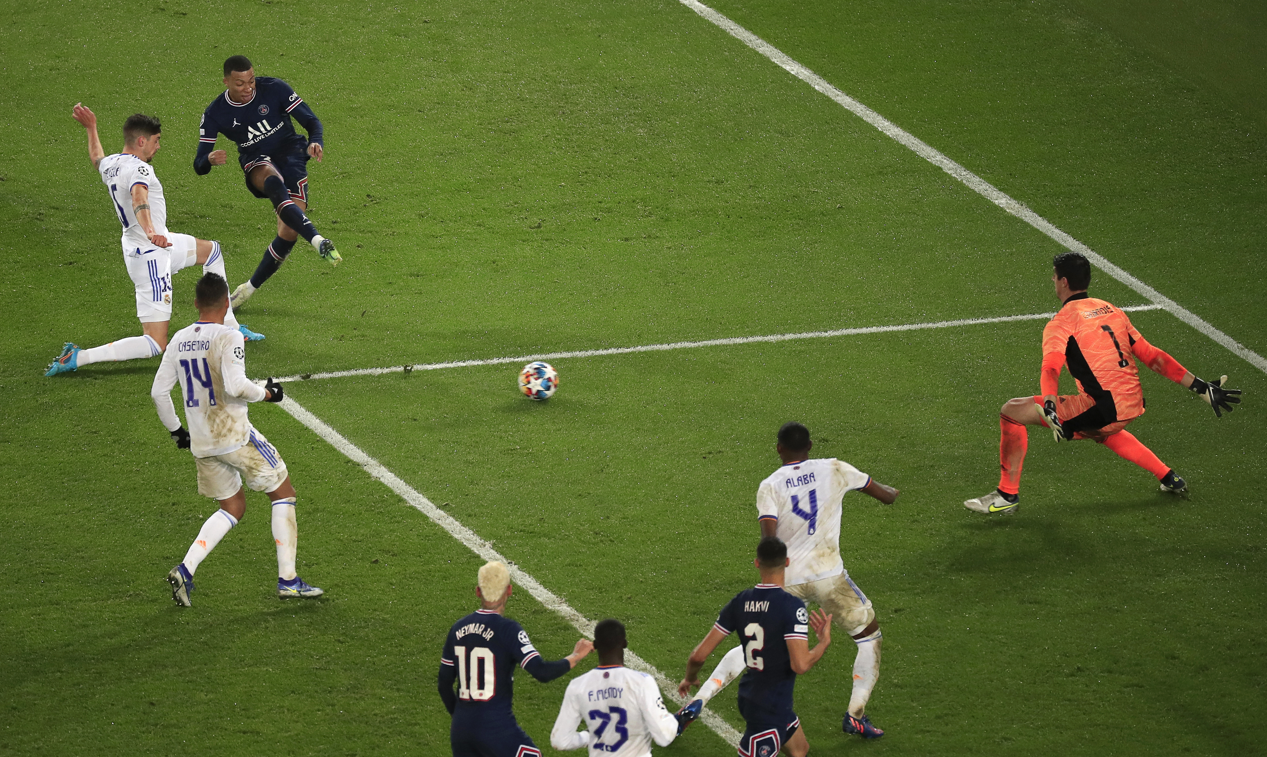 epa09760438 Kylian Mbappe (3-L) of PSG scores the 1-0 lead during the UEFA Champions League round of 16, first leg soccer match between Paris Saint-Germain (PSG) and Real Madrid in Paris, France, 15 February 2022.  EPA-EFE/Christophe Petit Tesson