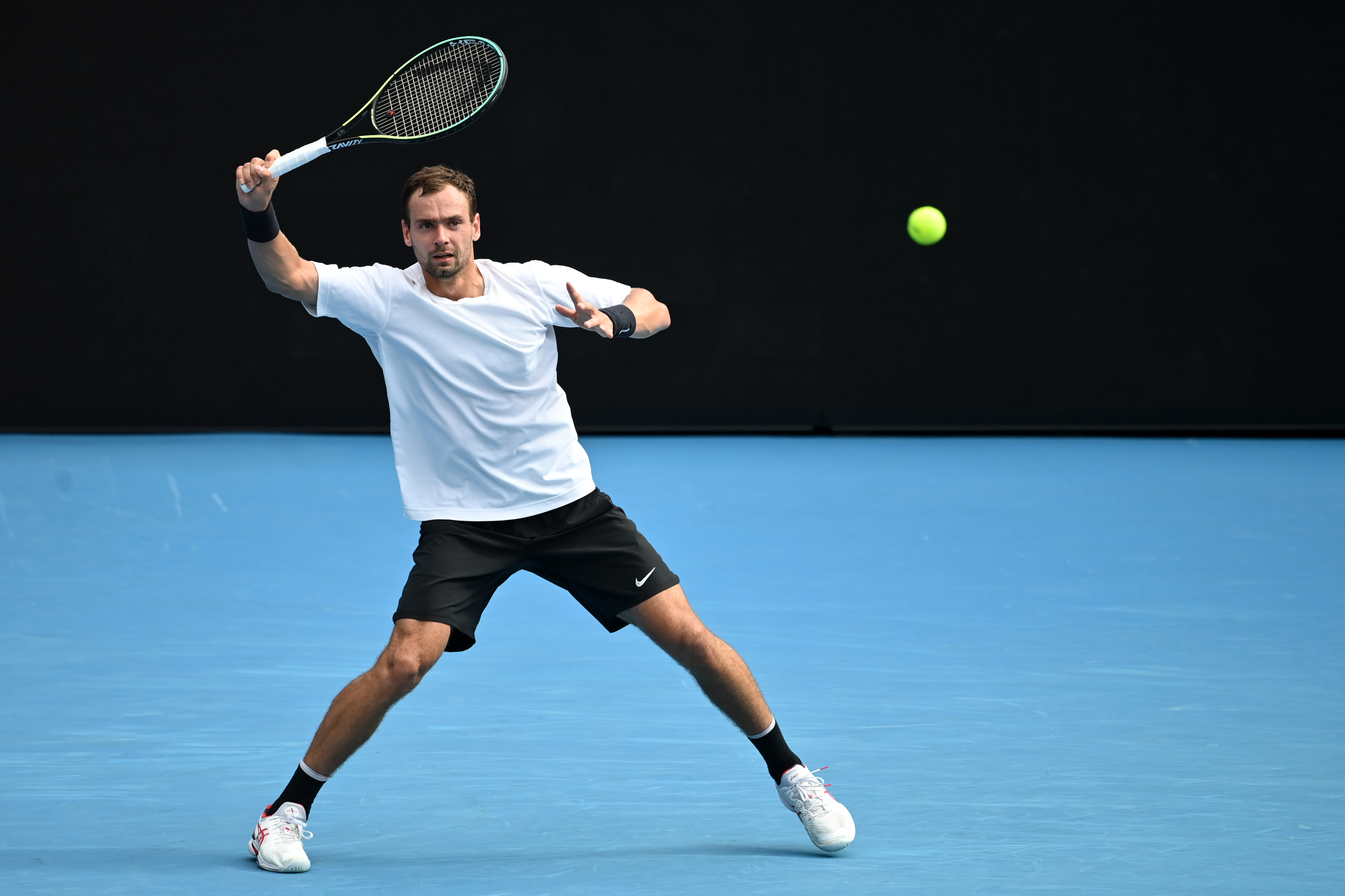 epa09692271 Roman Safiullin of Russia returns to Alex Molcan of Slovakia in their first round match for the Australian Open tennis tournament at Melbourne Park, in Melbourne, Australia, 18 January 2022.  EPA-EFE/JOEL CARRETT AUSTRALIA AND NEW ZEALAND OUT