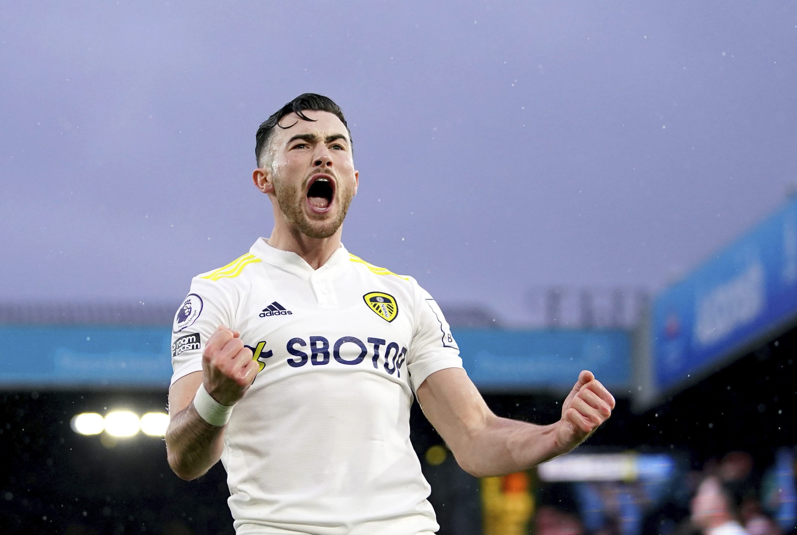 Leeds United's Jack Harrison celebrates scoring his side's first goal of the game , during the English Premier League soccer match between Leeds United and Burnley,  at Elland Road, in Leeds. England, Sunday, Jan. 2, 2022. (Mike Egerton/PA via AP)