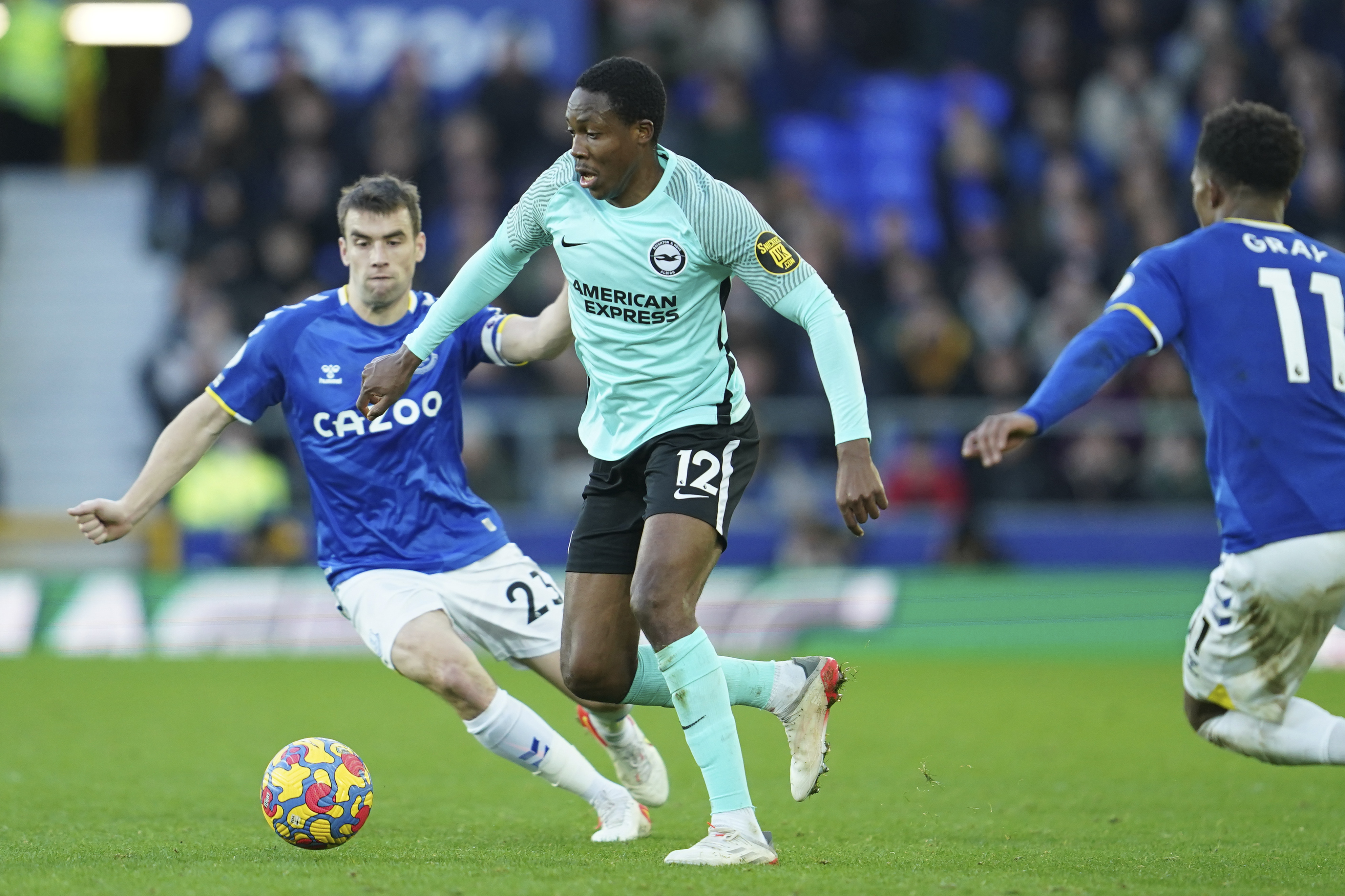 Brighton's Enock Mwepu, right, battles for the ball with Everton's Seamus Coleman during the English Premier League soccer match between Everton and Brighton at Goodison Park stadium in Liverpool, England, Sunday, Jan. 2, 2022. (AP Photo/Jon Super)