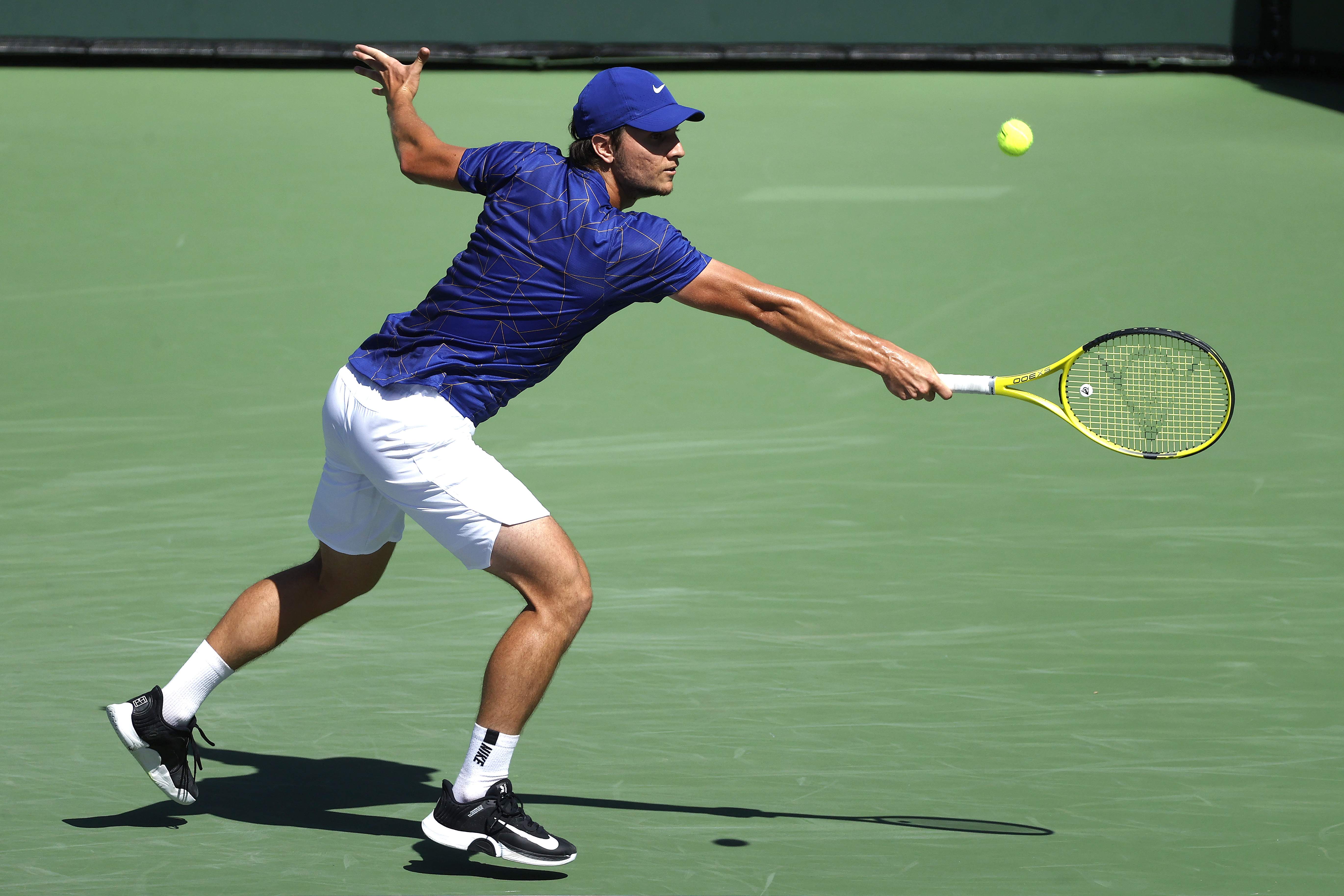 epa09829638 Miomir Kecmanovic of Serbia in action against Matteo Berrettini of Italy at the BNP Paribas Open tennis tournament at the Indian Wells Tennis Garden in Indian Wells, California, USA, 16 March 2022.  EPA-EFE/JOHN G MABANGLO