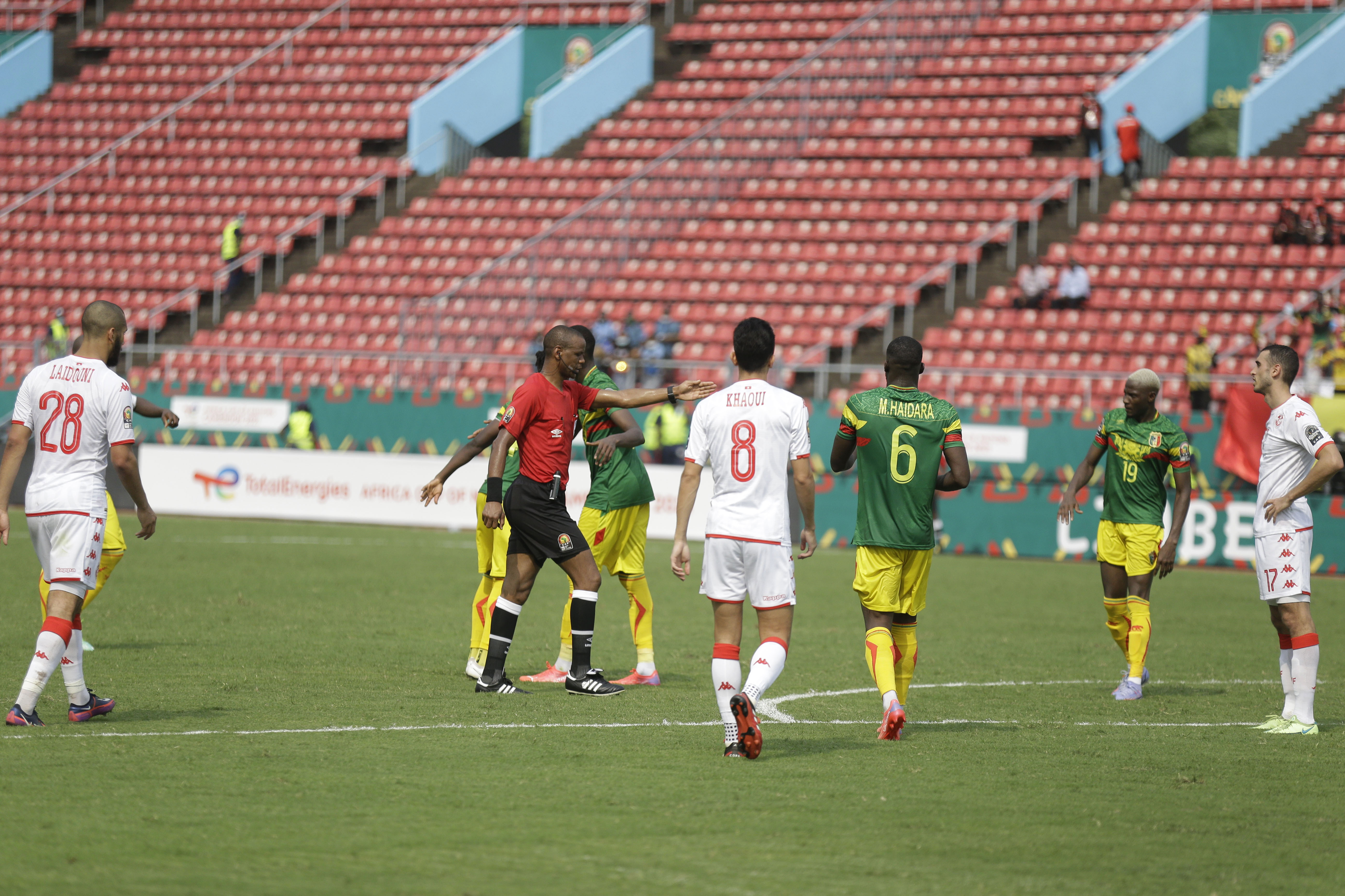 Referee Janny Sikazwe of Zambia, centre, awards a penalty to Mali, during the African Cup of Nations 2022 group F soccer match between Tunisia and Mali at the Limbe Omnisport Stadium in Limbe, Cameroon, Wednesday, Jan. 12, 2022. (AP Photo/Sunday Alamba)