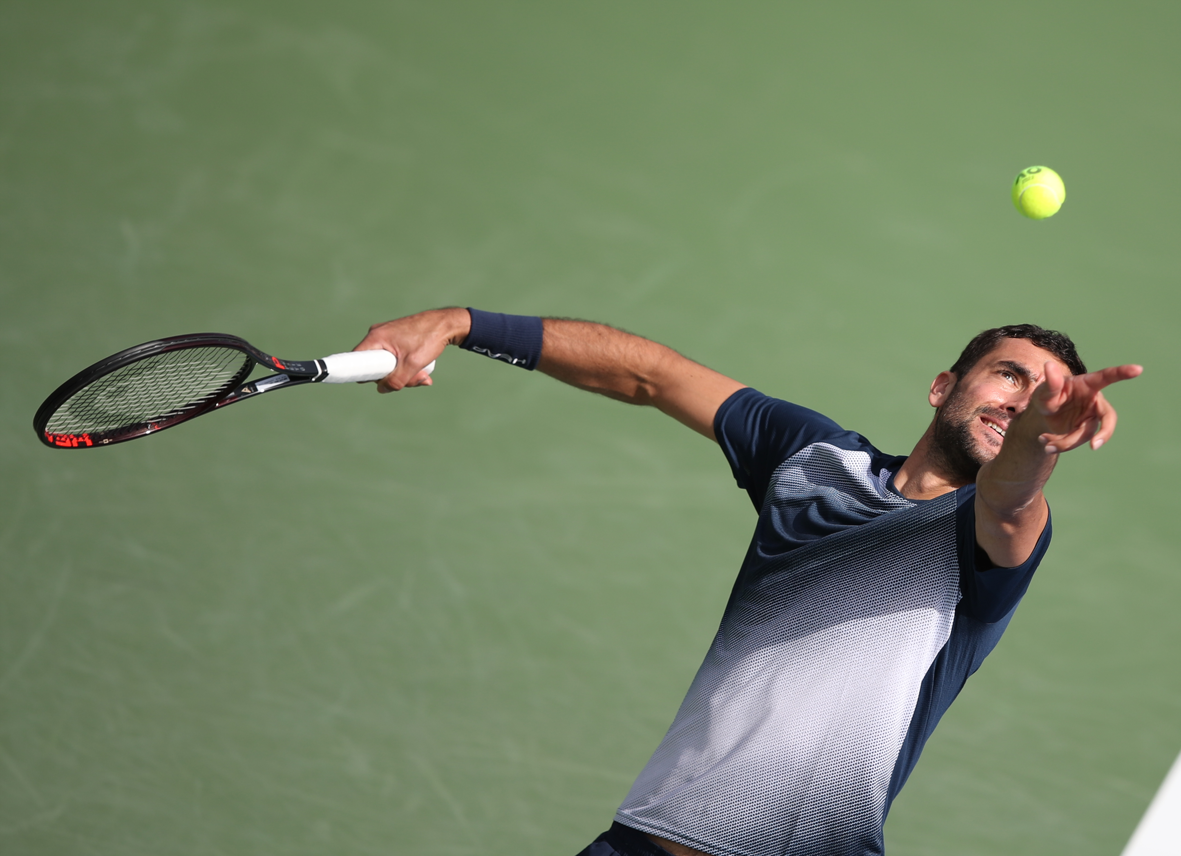 epa09775438 Marin Cilic of Croatia in action during his first round match against Jiri Vesely of the Czech Republic at the Dubai Duty Free Tennis ATP Championships 2022 in Dubai, United Arab Emirates, 21 February 2022.  EPA-EFE/ALI HAIDER