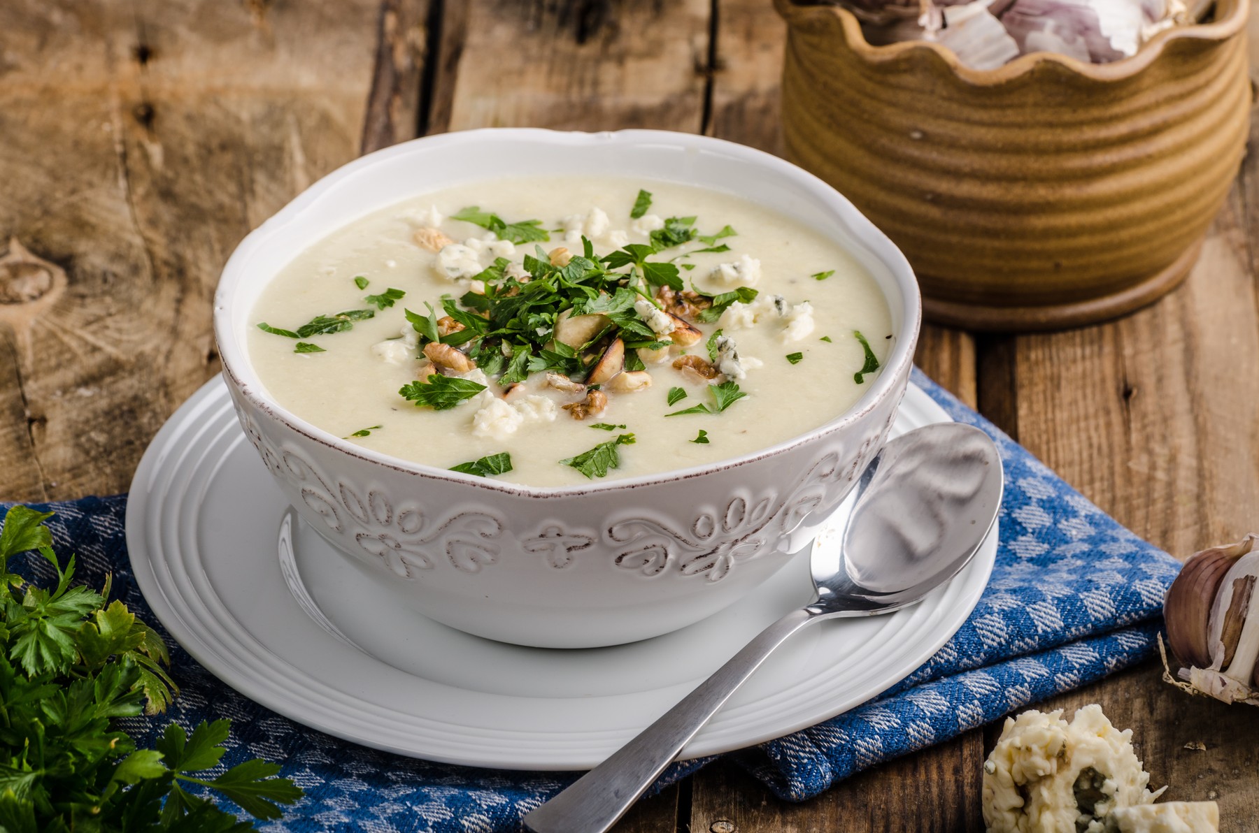 Cauliflower soup with blue cheese,  roasted nuts and herbs on top,  ready for advertisnig,  nice wooden board,  old wood,Image: 528888857, License: Royalty-free, Restrictions: , Model Release: no, Credit line: Petr Štěpánek / Panthermedia / Profimedia