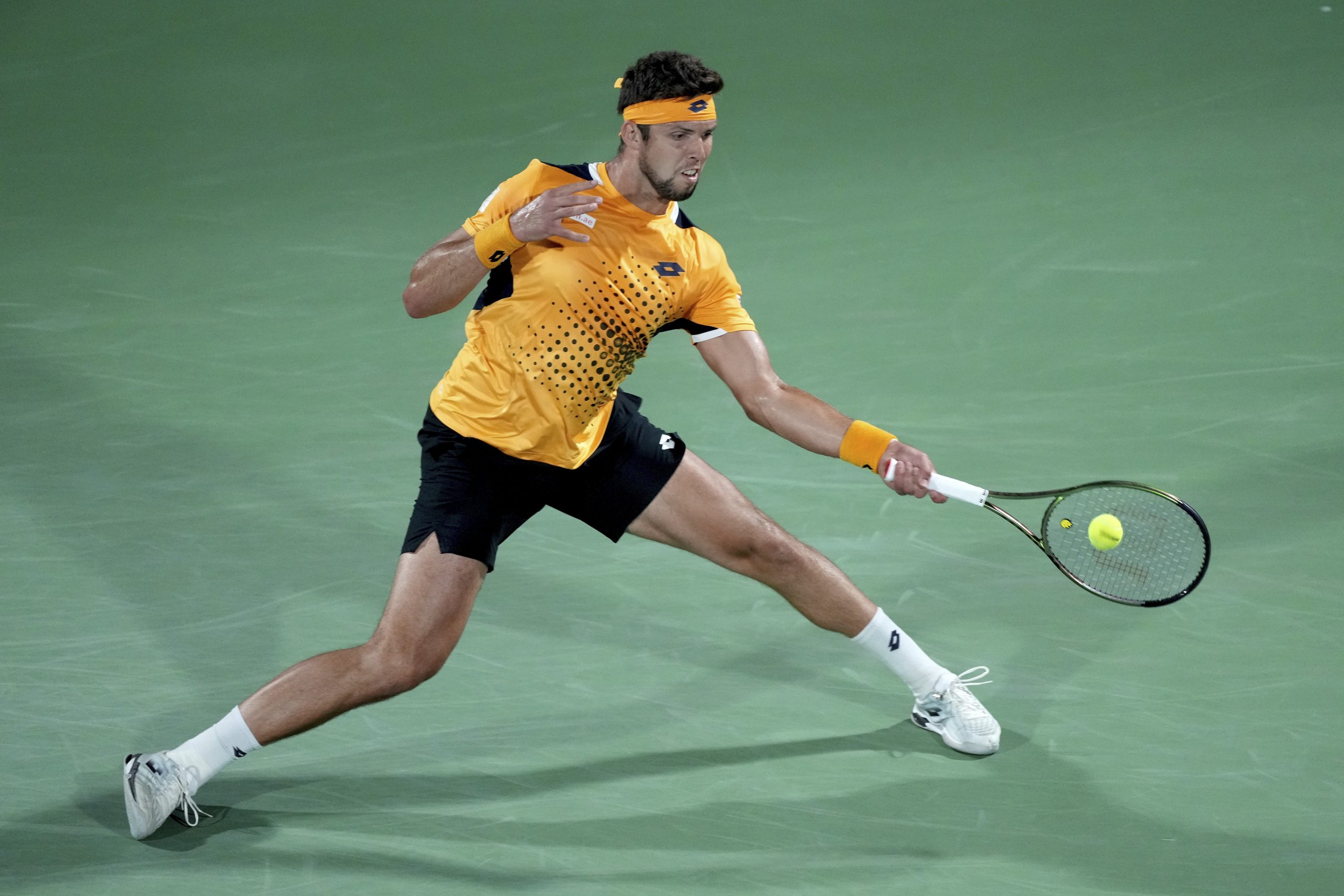 Czech Republic's Jiri Vesely returns the ball to Serbia's Novak Djokovic during a match at the Dubai Duty Free Tennis Championship in Dubai, United Arab Emirates, Thursday, Feb. 24, 2022. (AP Photo/Ebrahim Noroozi)