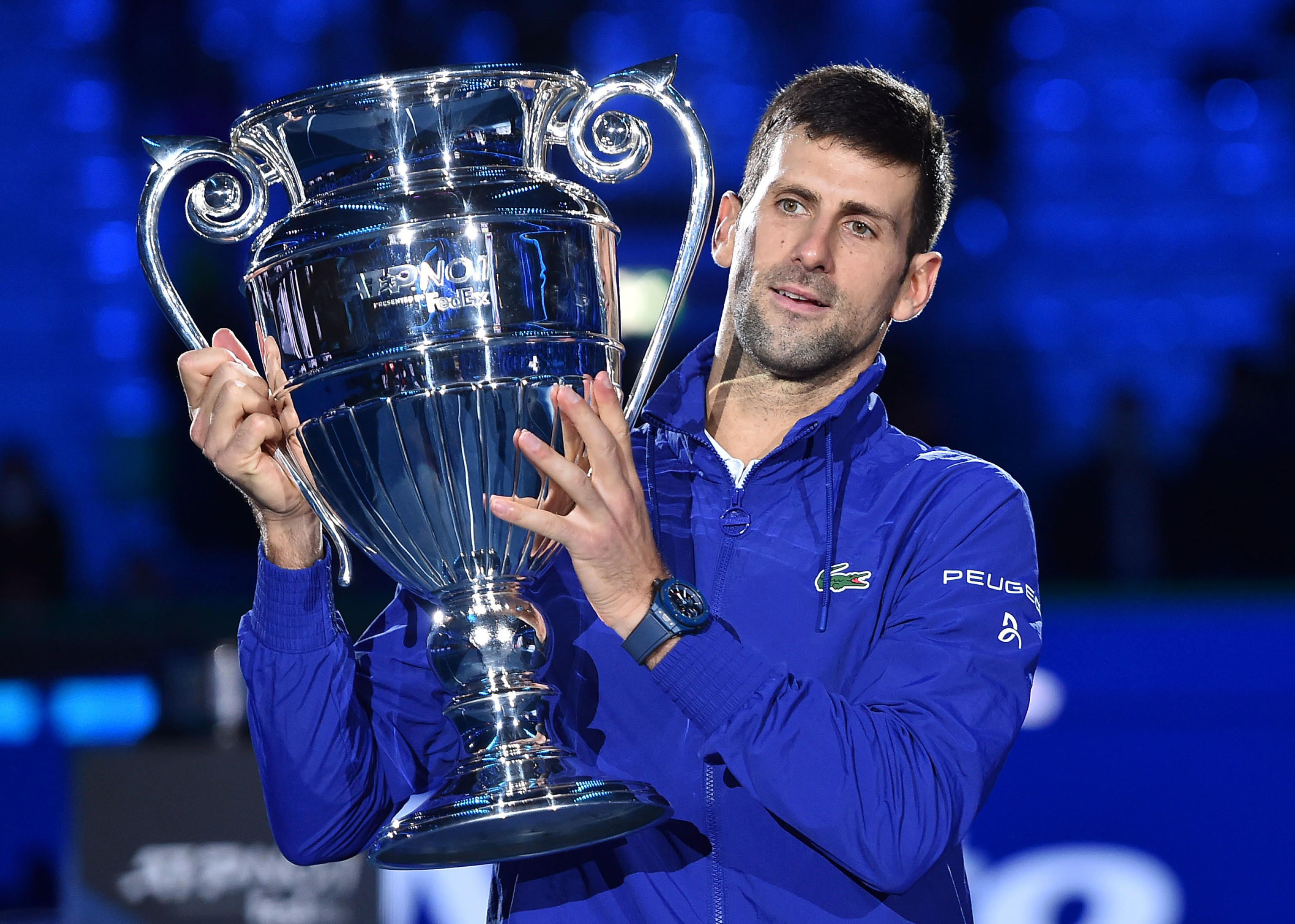 epa09583651 Novak Djokovic of Serbia poses with the ATP World Tour No. 1 Award trophy he received for the seventh time during the Nitto ATP Finals tennis tournament in Turin, Italy, 15 November 2021.  EPA-EFE/Alessandro Di Marco