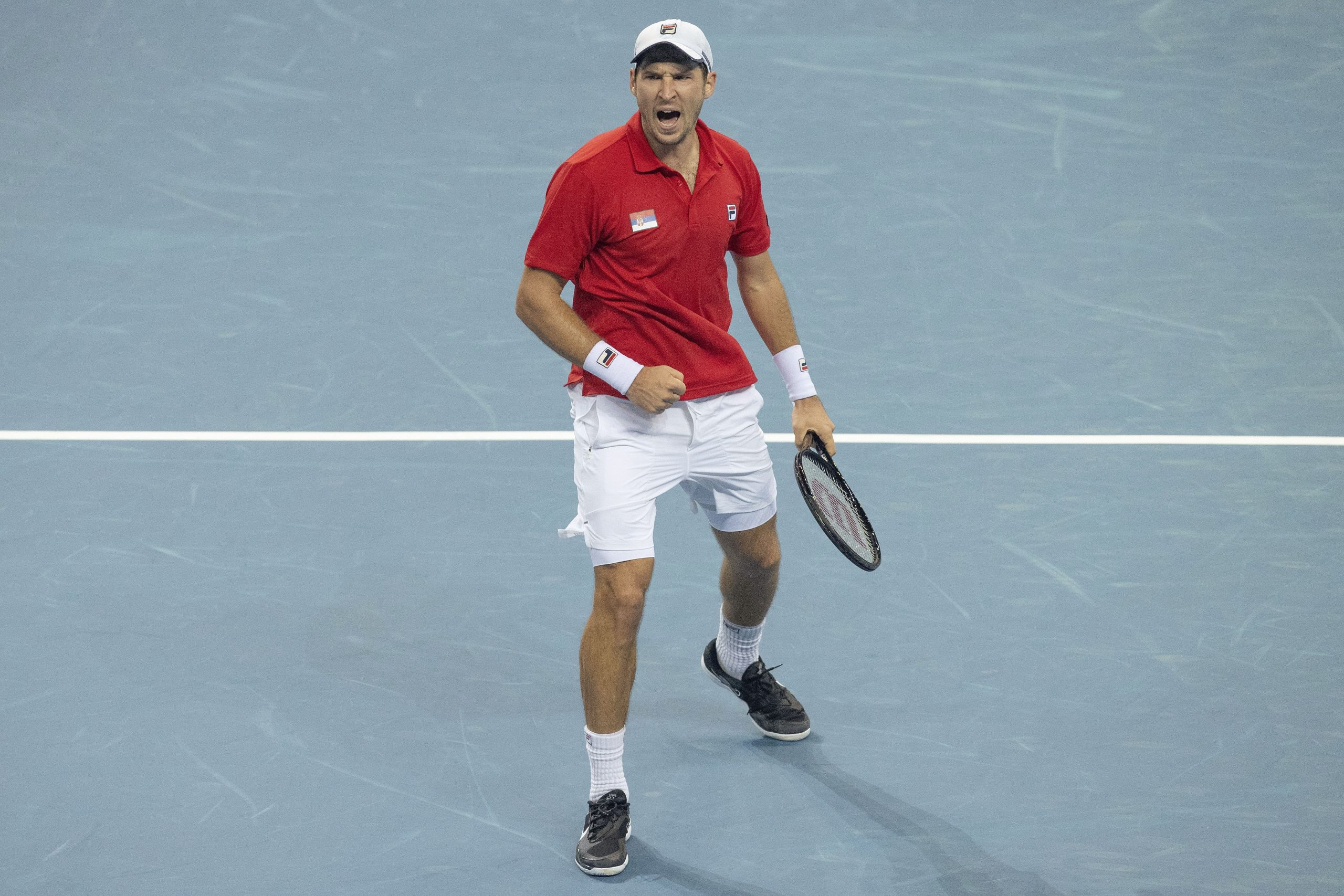 Dusan Lajovic of Serbia reacting winning the first set against Chile's Cristian Garin Serbia during their match at the ATP Cup tennis tournament in Sydney, Monday, Jan. 3, 2022. (AP Photo/Steve Christo)