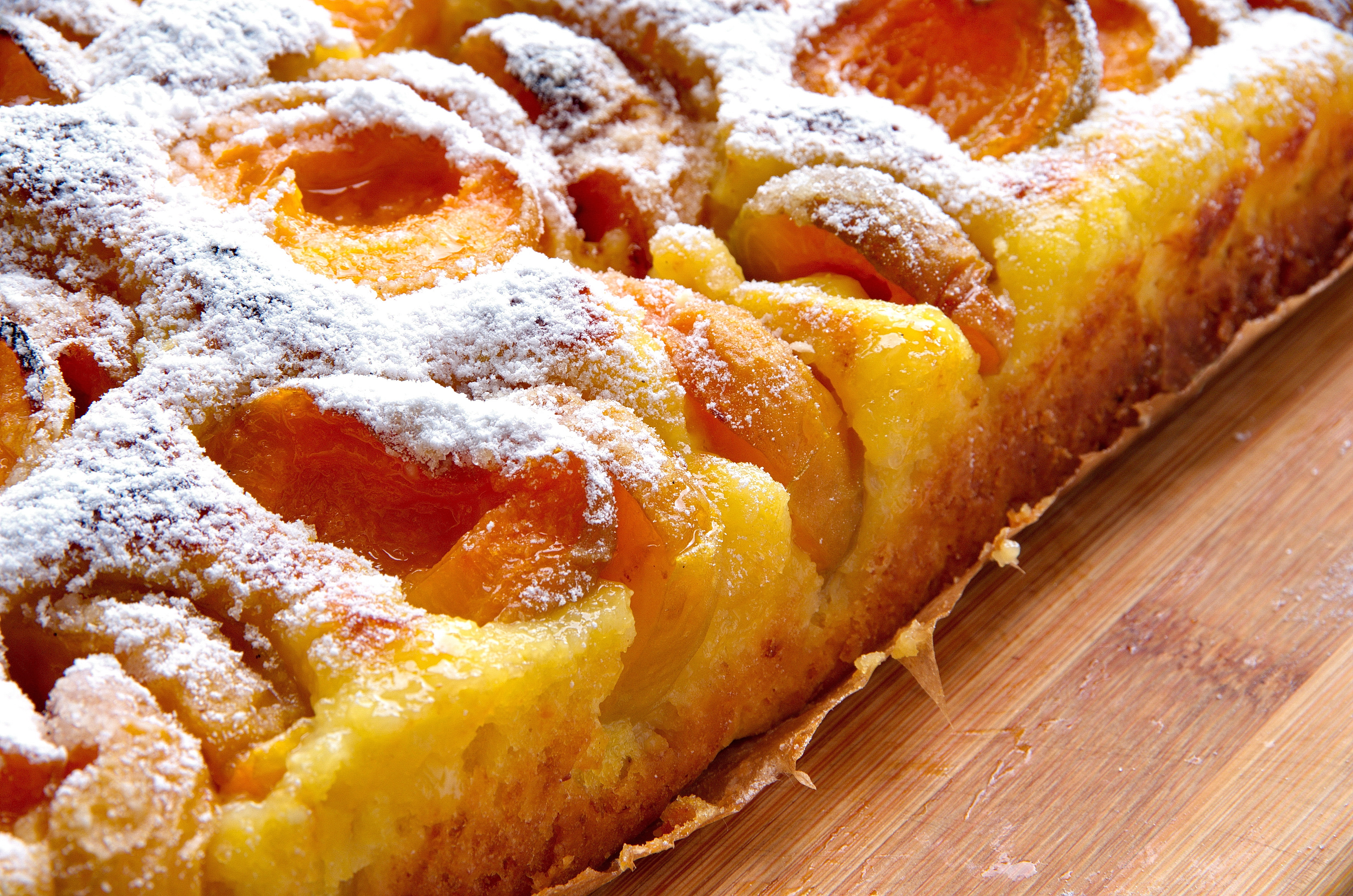 21.7.21. (c) Kajsija kolac stock-photo-close-up-of-a-surface-of-homemade-apricot-cake-on-wooden-table-delicious-fresh-rustic-apricot-cake-1138312769