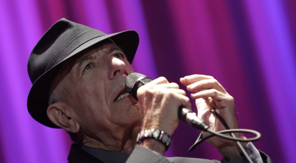 epa03420198 Canadian singer and composer Leonard Cohen, performs during his concert at Palau Sant Jordi in Barcelona, Spain, 03 October 2012.  EPA/ALBERT OLIVE