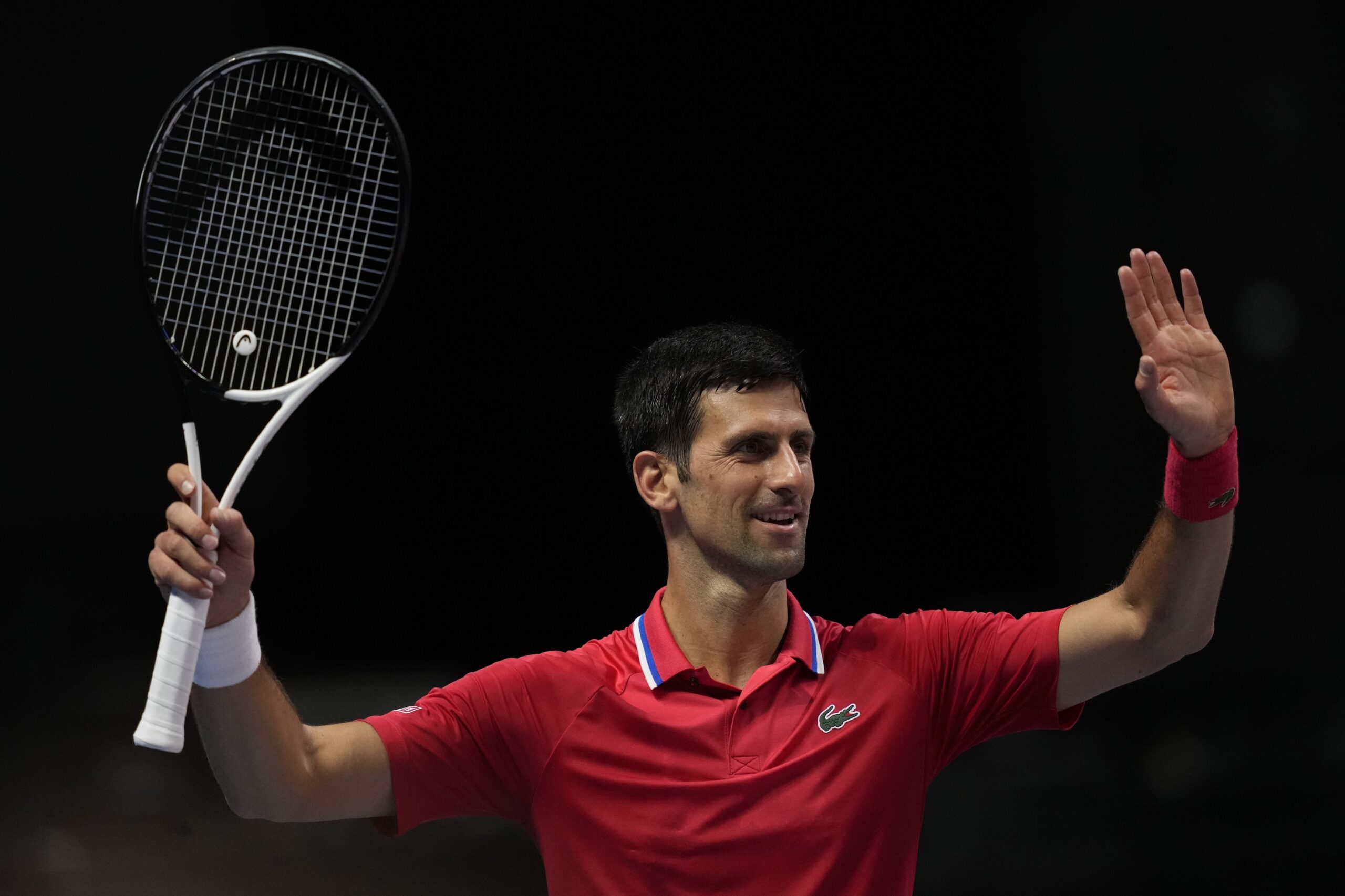 Serbia's Novak Djokovic of Falcons, reacts against Austria's Sebastian Ofner of Kites, during a match of the World Tennis League at Coca-Cola Arena, in Dubai, United Arab Emirates, Friday, Dec. 23, 2022. (AP Photo/Kamran Jebreili)