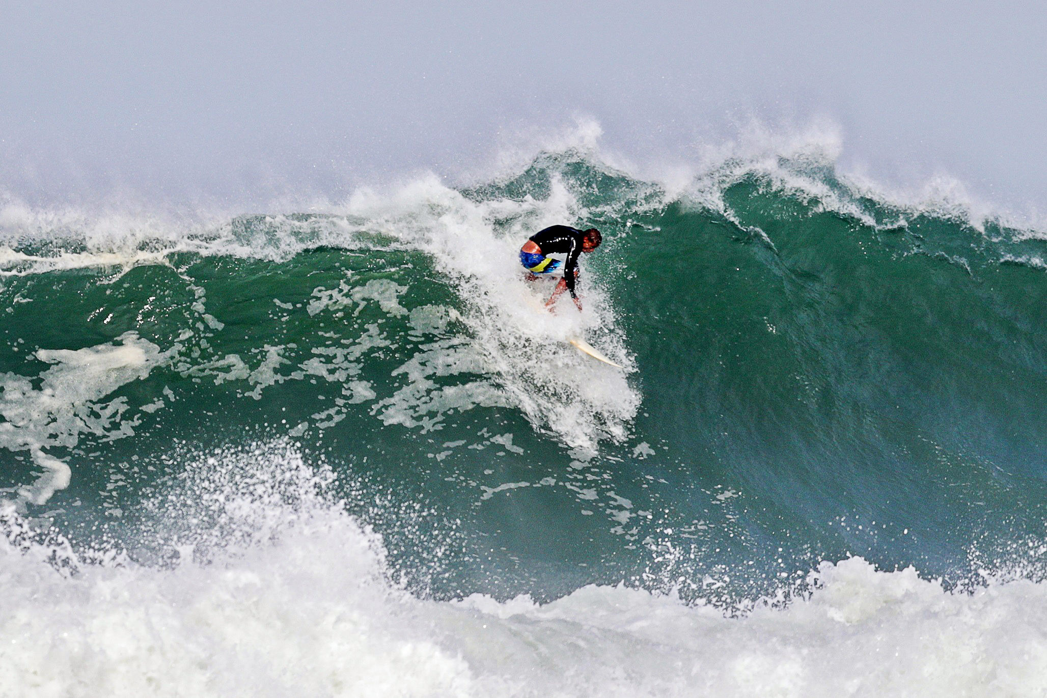 Surfing at Itacoatiara beach in Brazil