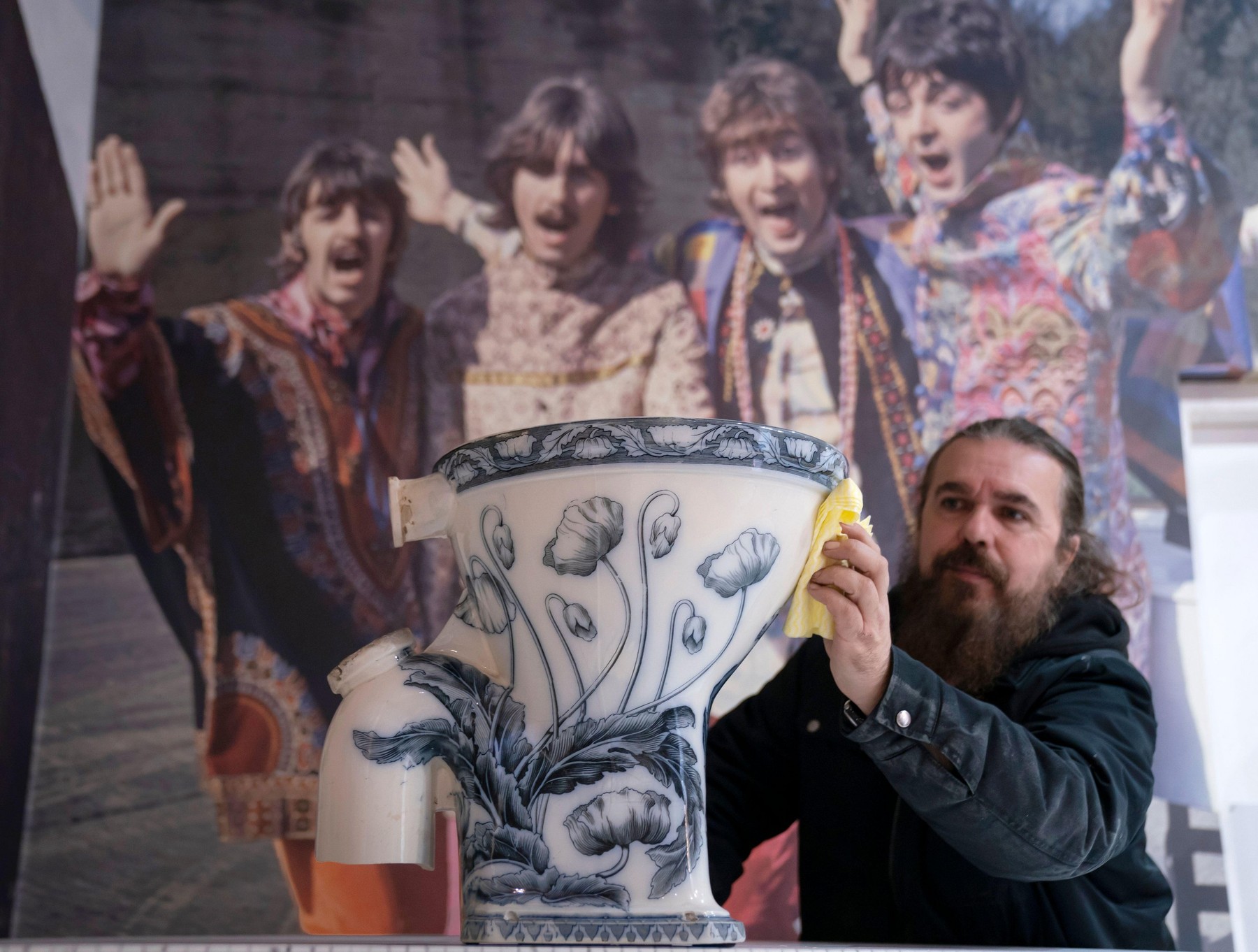 Roag Best gives a final polish to John Lennon's toilet from his Tittenhurst Estate in Berkshire, where he lived with Yoko Ono in 1971, ahead of the item going on display at the Liverpool Beatles Museum. Picture date: Thursday December 8, 2022.