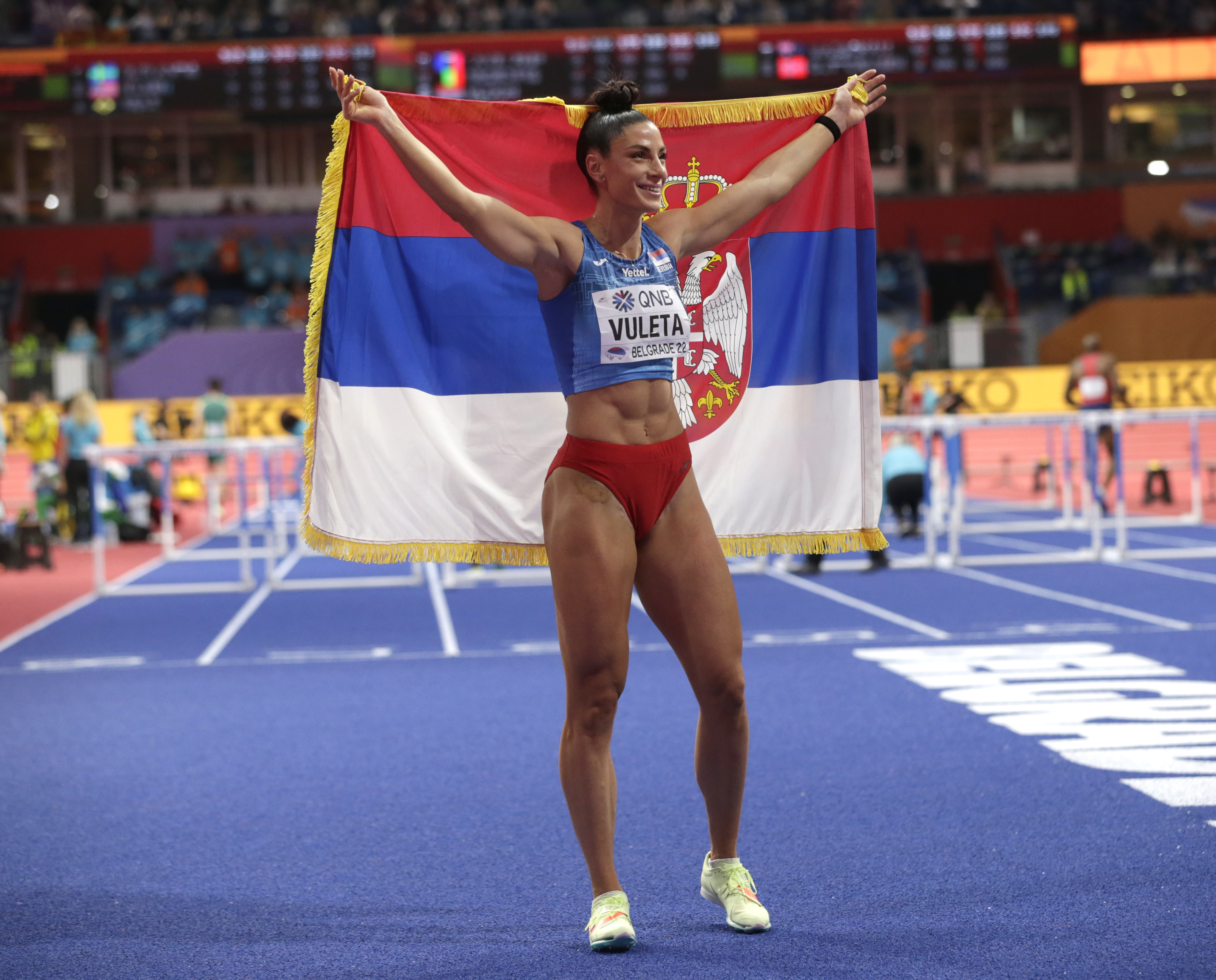 epa09839167 Ivana Vuleta of Serbia celebrates after winning the women's Long Jump final at the IAAF World Athletics Indoor Championships in Belgrade, Serbia, 20 March 2022.  EPA-EFE/ANDREJ CUKIC