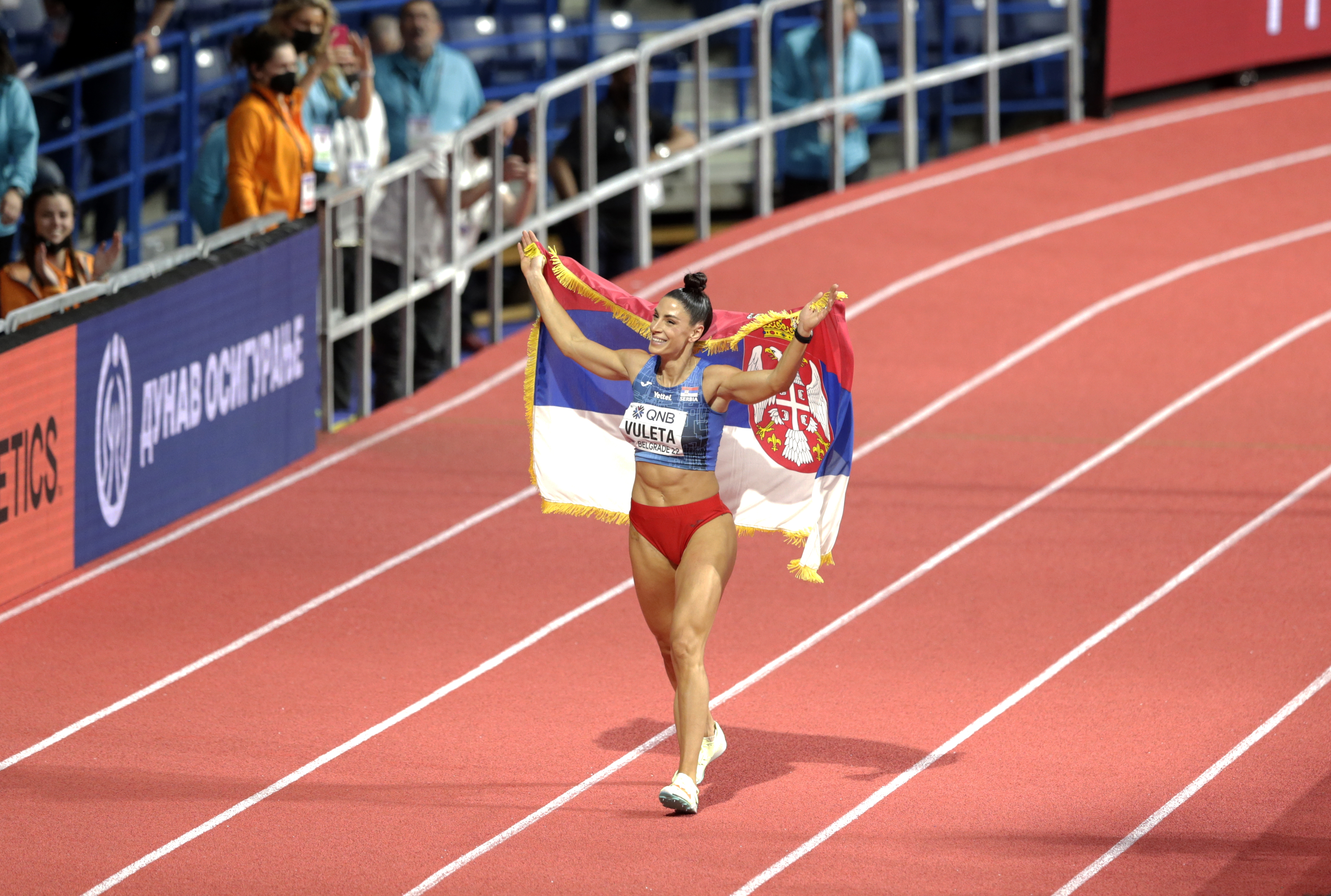 epa09839168 Ivana Vuleta of Serbia celebrates after winning the women's Long Jump final at the IAAF World Athletics Indoor Championships in Belgrade, Serbia, 20 March 2022.  EPA-EFE/ANDREJ CUKIC