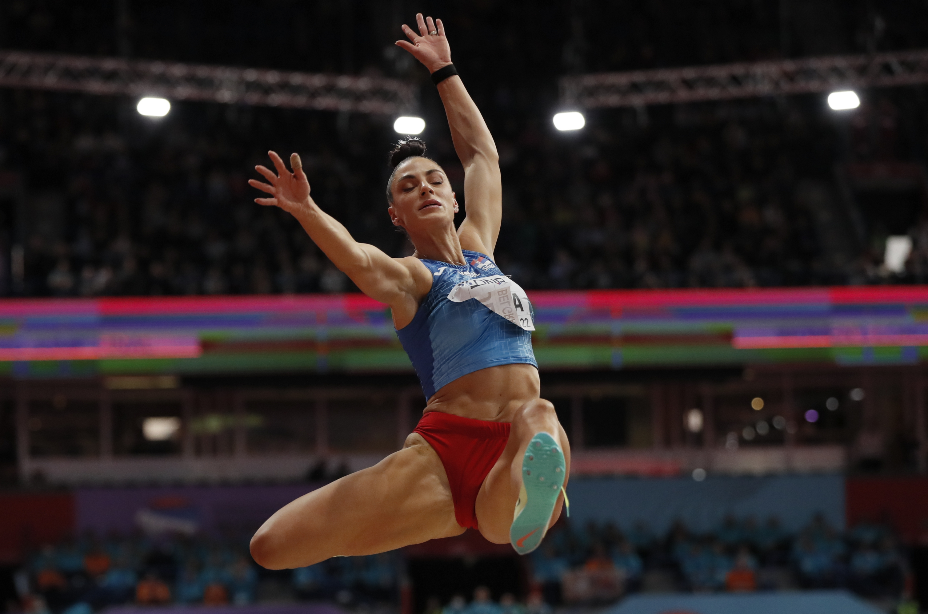epa09838877 Ivana Vuleta of Serbia competes in the women's Long Jump final at the IAAF World Athletics Indoor Championships in Belgrade, Serbia, 20 March 2022.  EPA-EFE/ROBERT GHEMENT