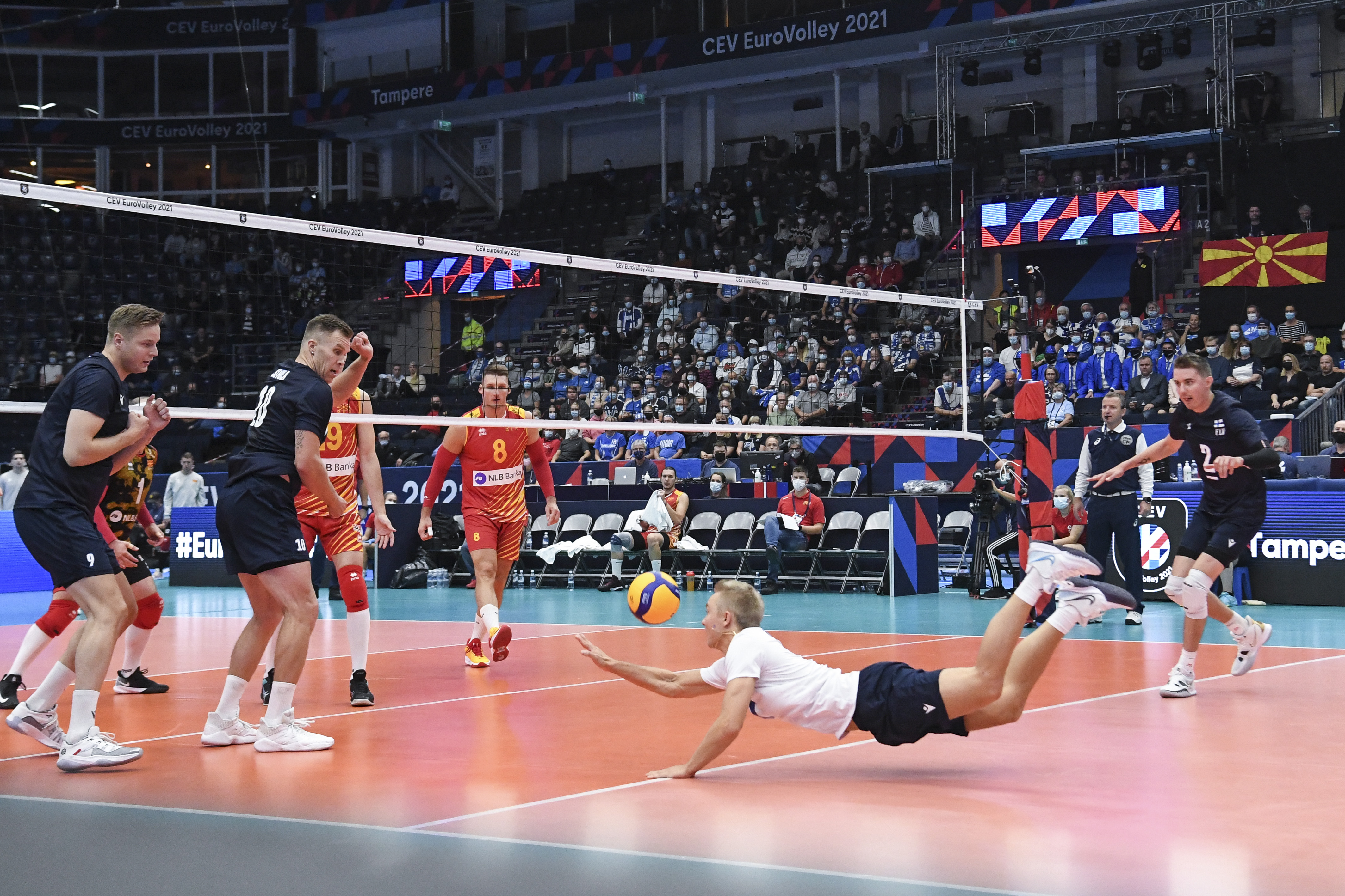 epa09441073 Lauri Kerminen (C) of Finland in action during the 2021 European Volleyball Championship match Finland vs North Macedonia in Tampere, Finland, 01 September 2021.  EPA-EFE/KIMMO BRANDT