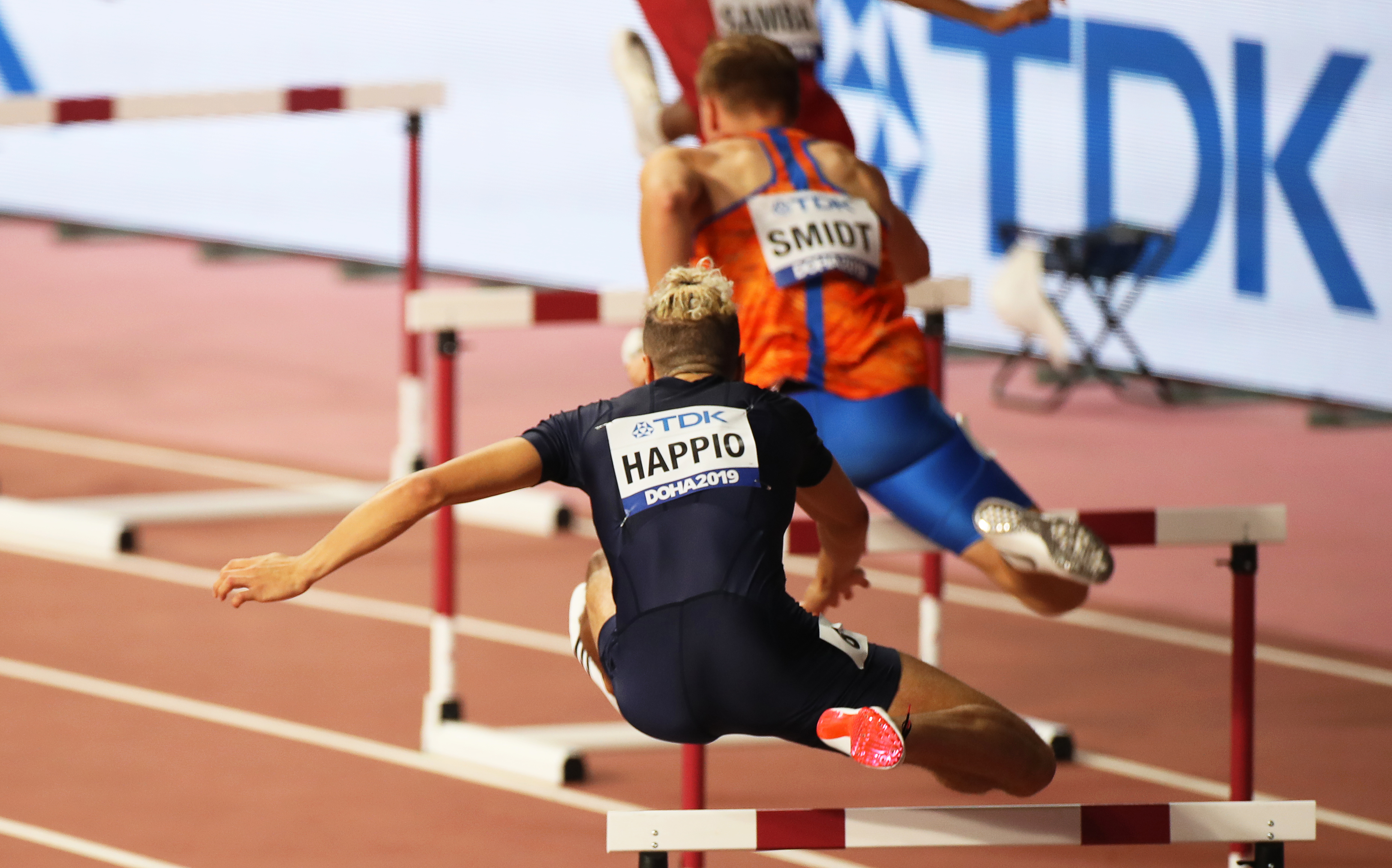 epa07874830 Wilfried Happio (front) of France in action during the men's 400m Hurdles heats at the IAAF World Athletics Championships 2019 at the Khalifa Stadium in Doha, Qatar, 27 September 2019. EPA-EFE/YAHYA ARHAB