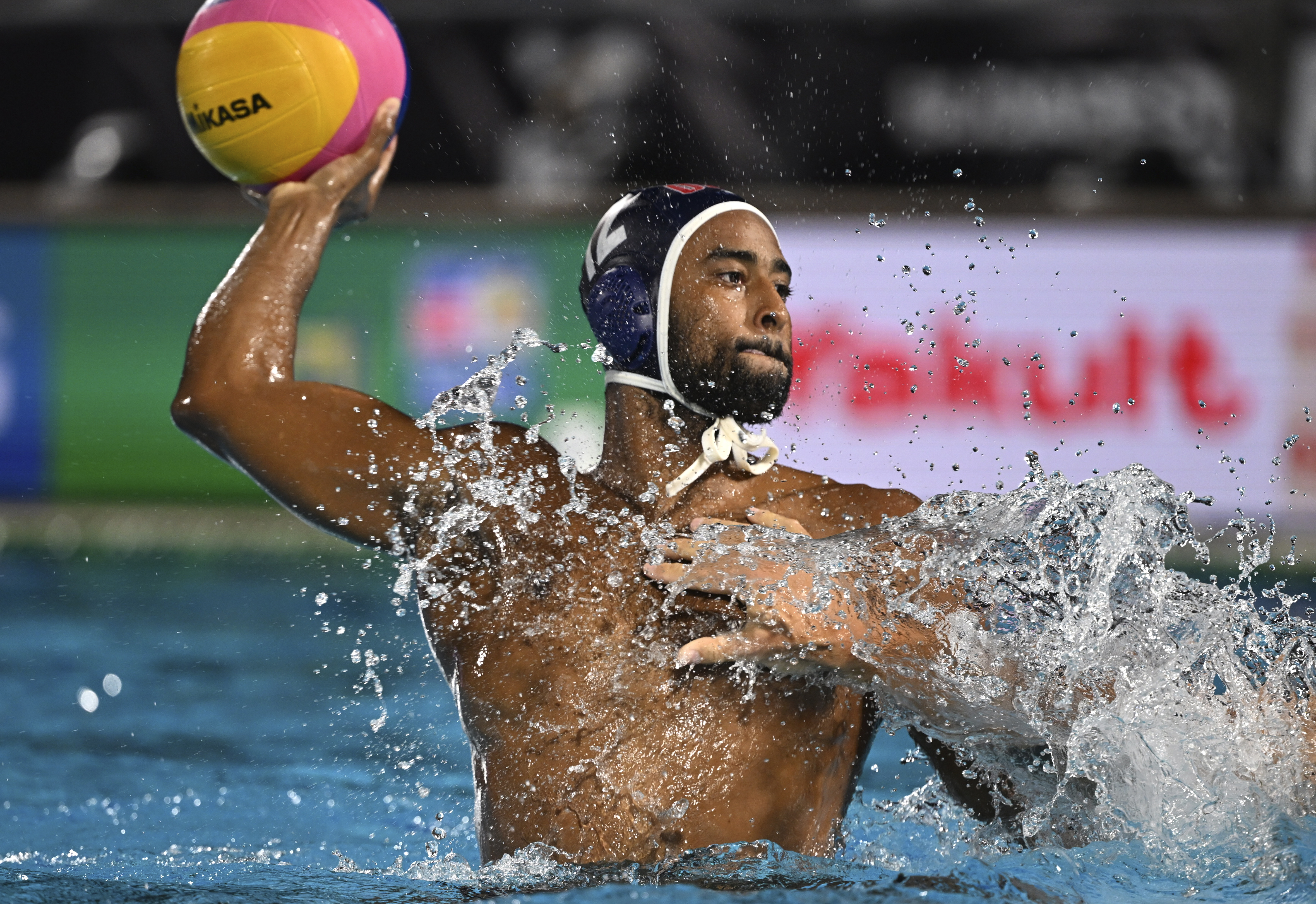 Maxwell Irving of the United States takes a shot during the Men's water polo classification match between Hungary and the United States at the 19th FINA World Championships in Budapest, Hungary, Friday, July 1, 2022. (AP Photo/Anna Szilagyi)