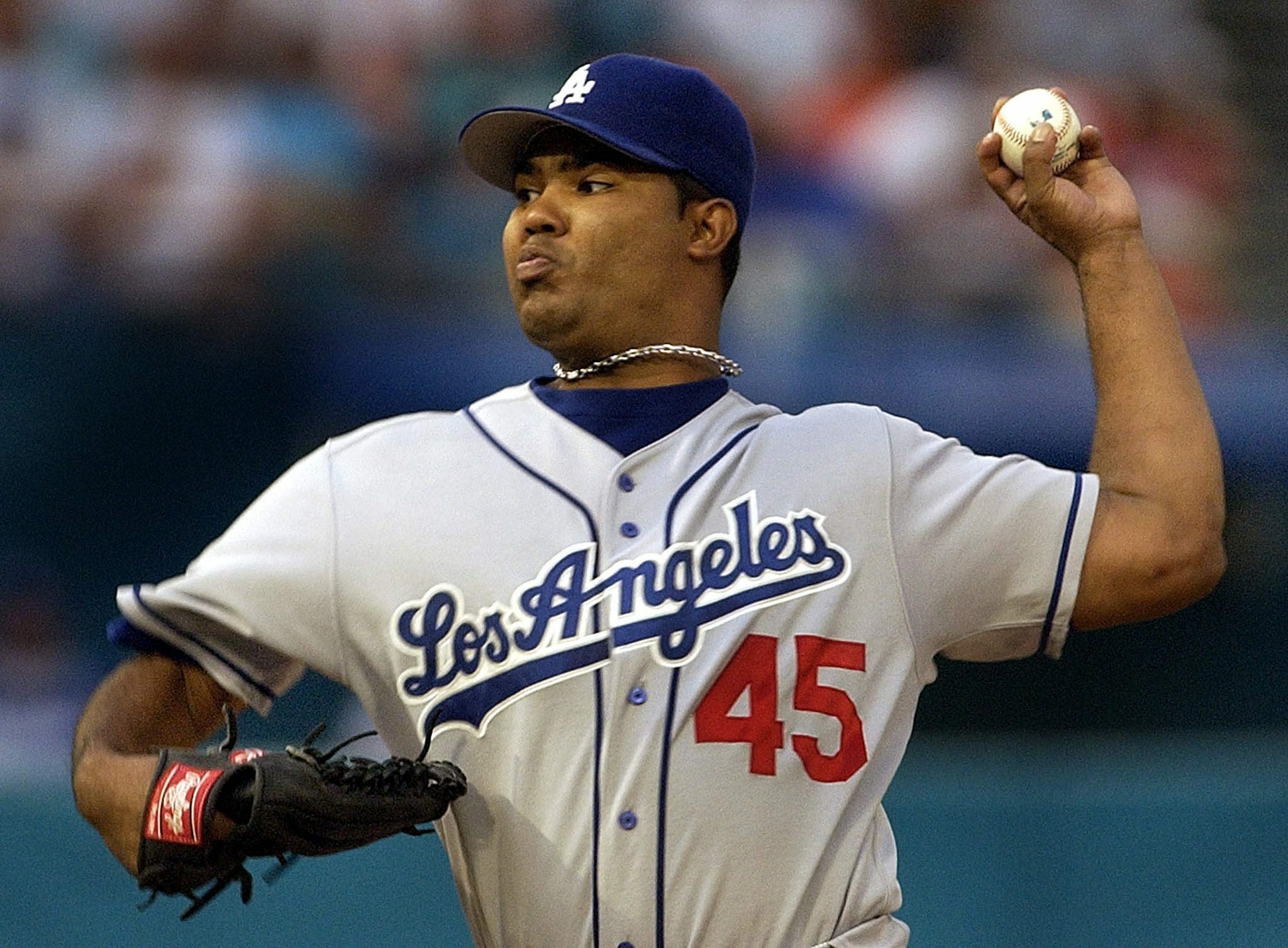 Los Angeles Dodges'pitcher Odalis Perez of the Domincan Republic delivers a pitch to Florida Marlin Ivan Rodriguez during 1st inning action of their game at Pro Player Stadium In Miami, Florida 11 August 2003.
EPA PHOTO/EPA/RHONA WISE