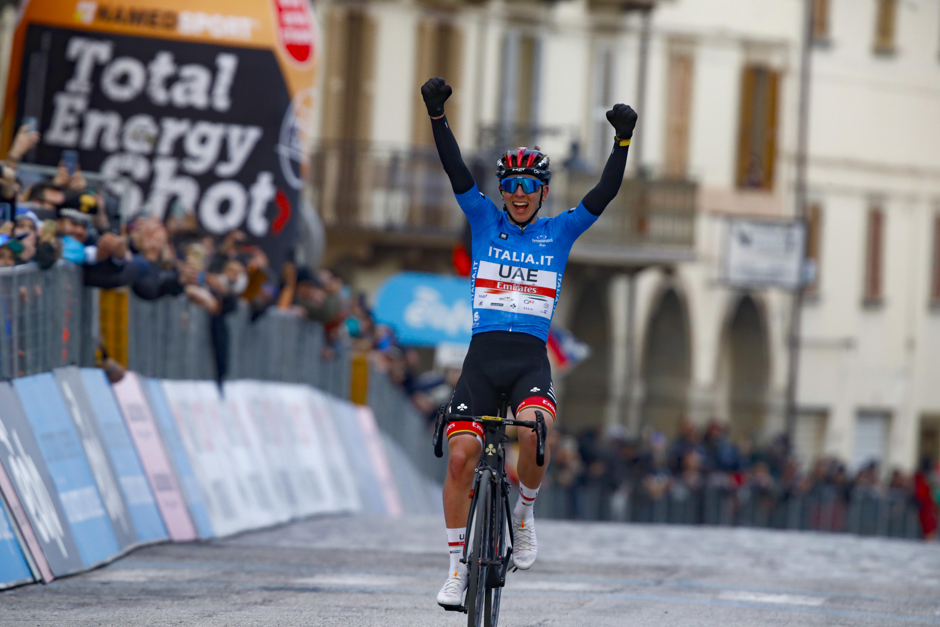 epa09819333 Slovenian rider Tadej Pogacar of team UAE Team Emirates celebrates winning the 6th stage of the Tirreno-Adriatico cycling race, over 215km between Apecchio and Carpenga, Italy, 12 March 2022.  EPA-EFE/ROBERTO BETTINI