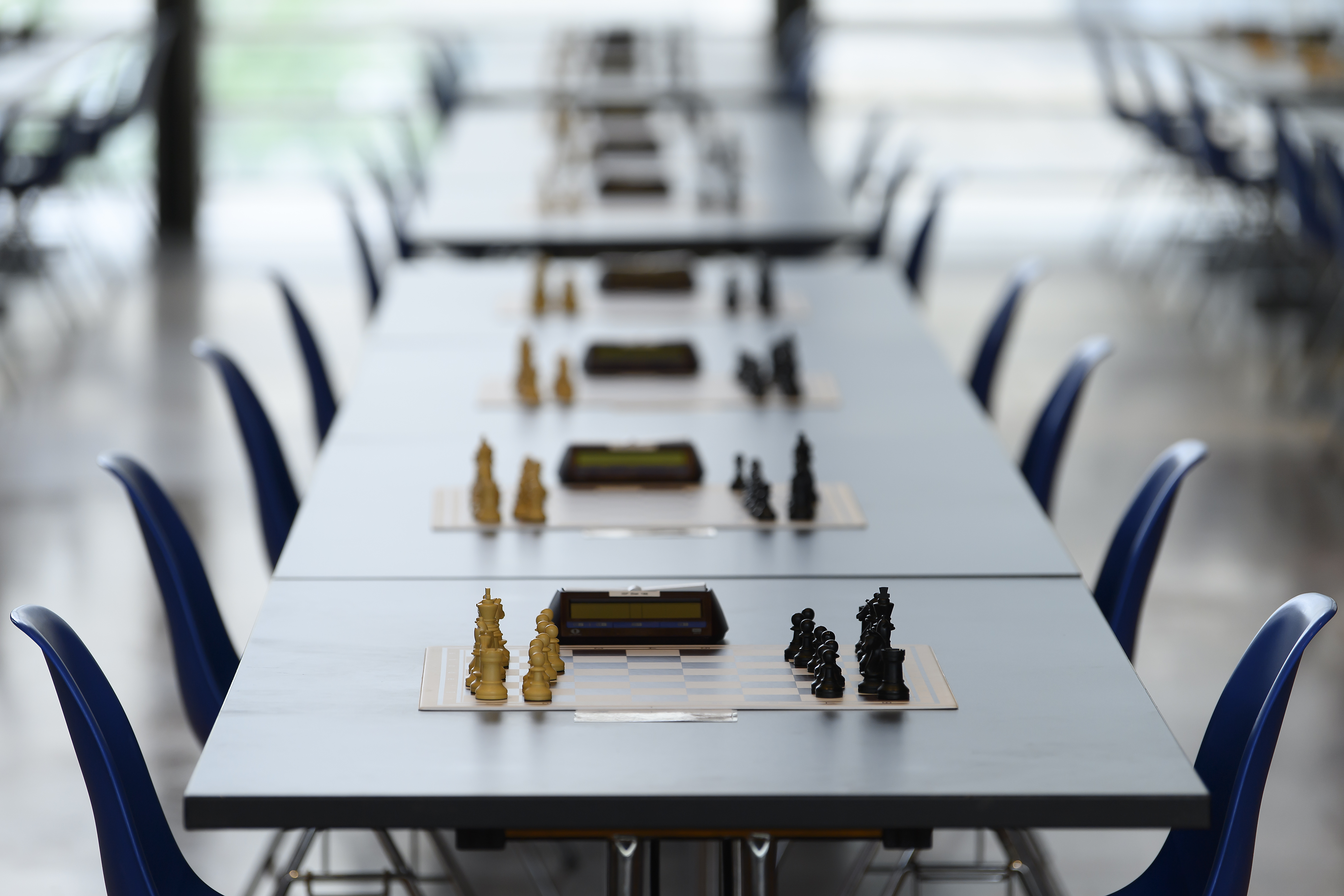 epa09365056 Chess games sit on tables during the Grand Master Triathlon (rapid) at the 54st Biel International Chess Festival in the Congress Center in Biel, Switzerland, 25 July 2021.  EPA-EFE/ANTHONY ANEX