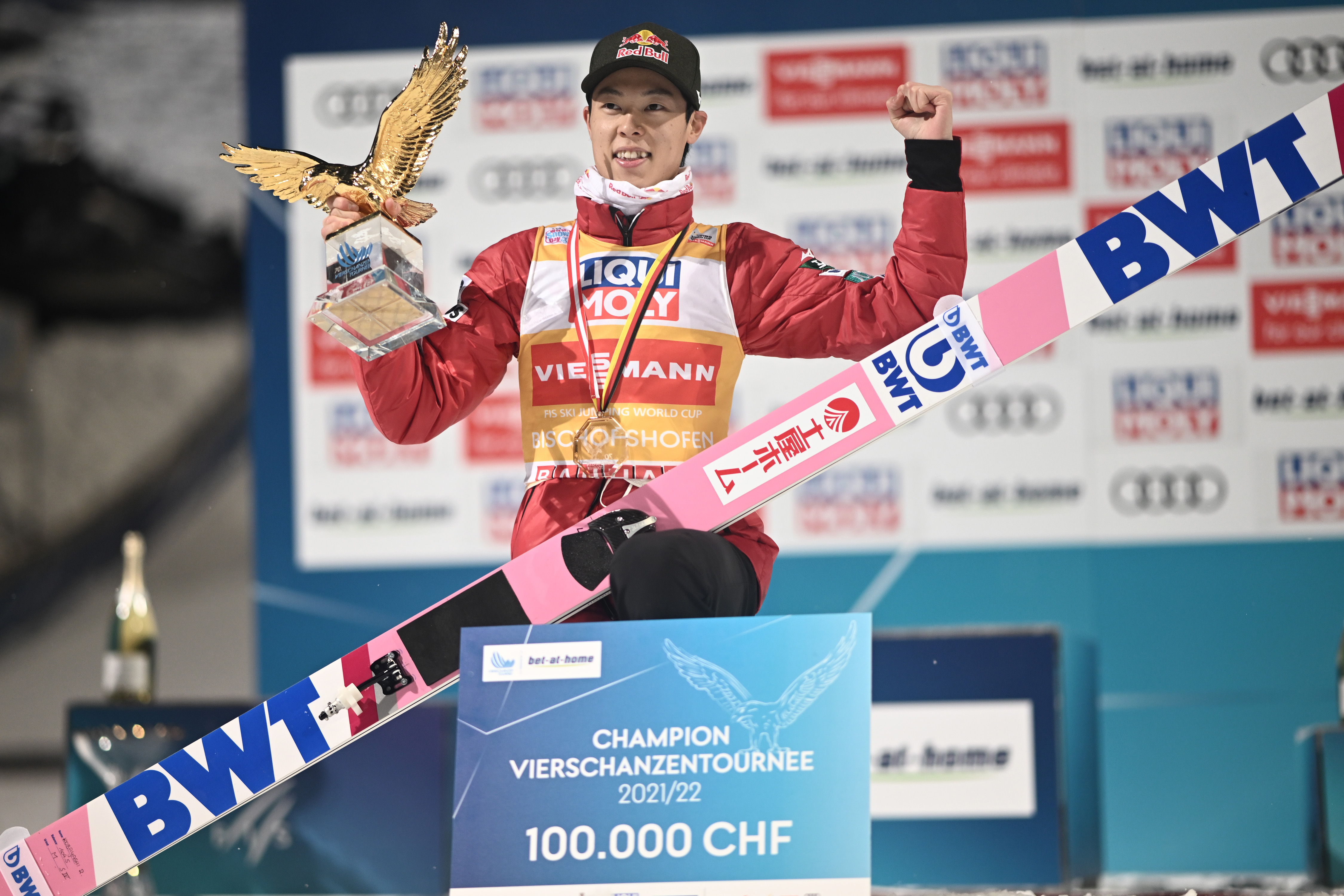 epa09670487 Winner Ryoyu Kobayashi of Japan celebrates on the podium for the 70th Four Hills Tournament in Bischofshofen, Austria, 06 January 2022.  EPA-EFE/CHRISTIAN BRUNA