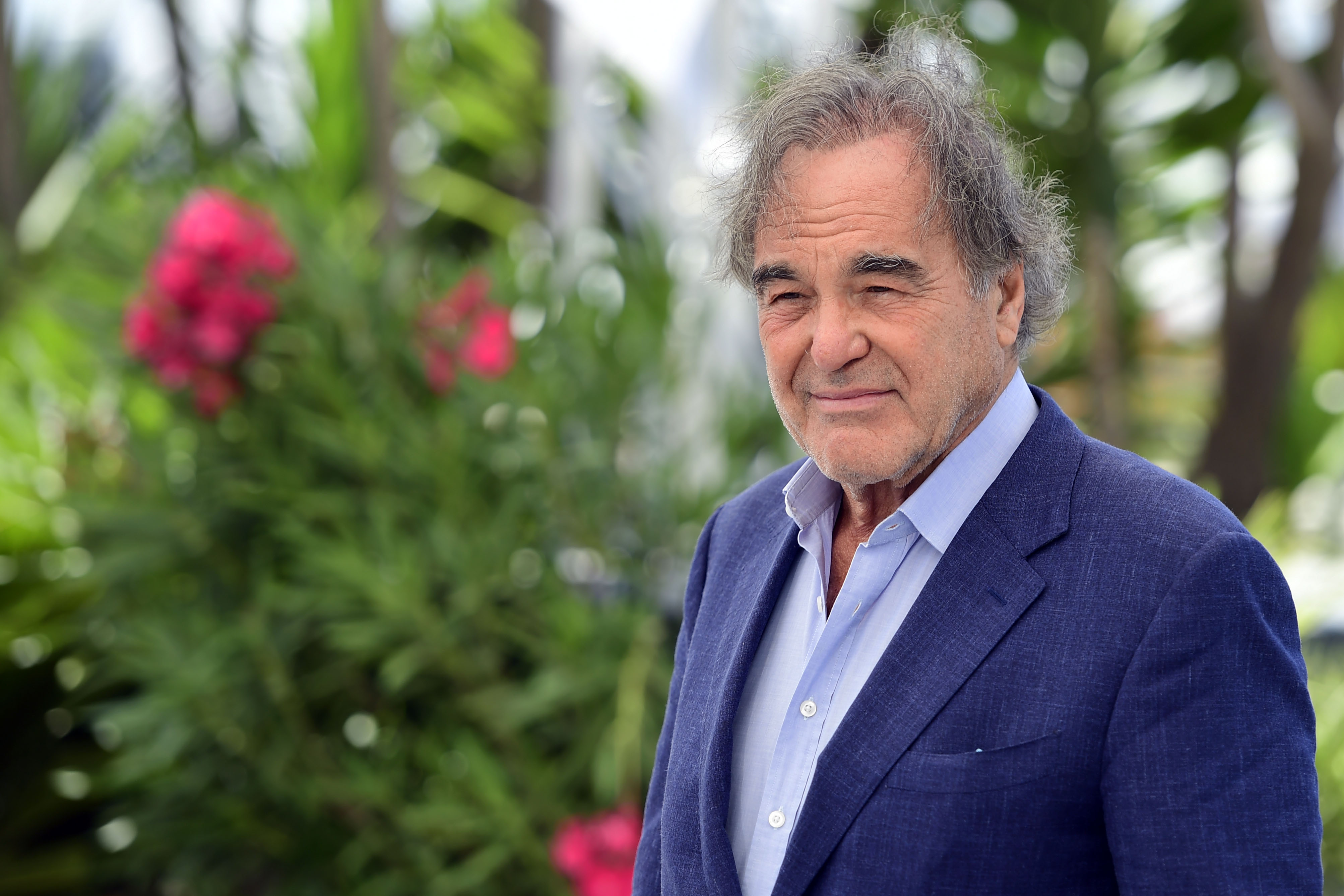 epa09342235 Oliver Stone poses during the photocall for 'JFK Revisited: Through The Looking Glass' at the 74th annual Cannes Film Festival, in Cannes, France, 13 July 2021. The festival runs from 06 to 17 July.  EPA-EFE/CAROLINE BLUMBERG